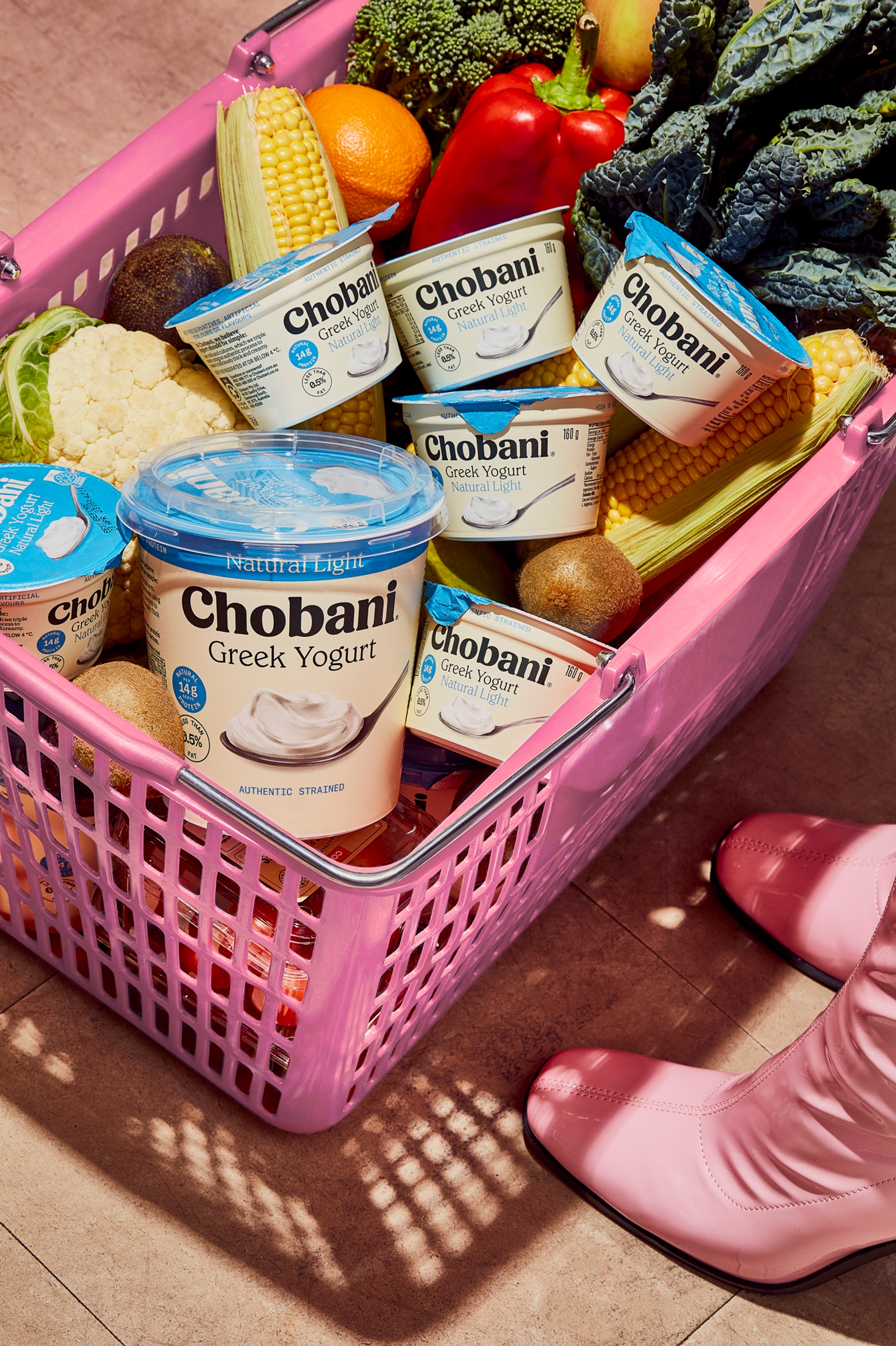 Chobani packaging design by Our Revolution in pink shopping basket filled with Chobani Greek Yogurt and colourful fruit and vegetables Jen Doran