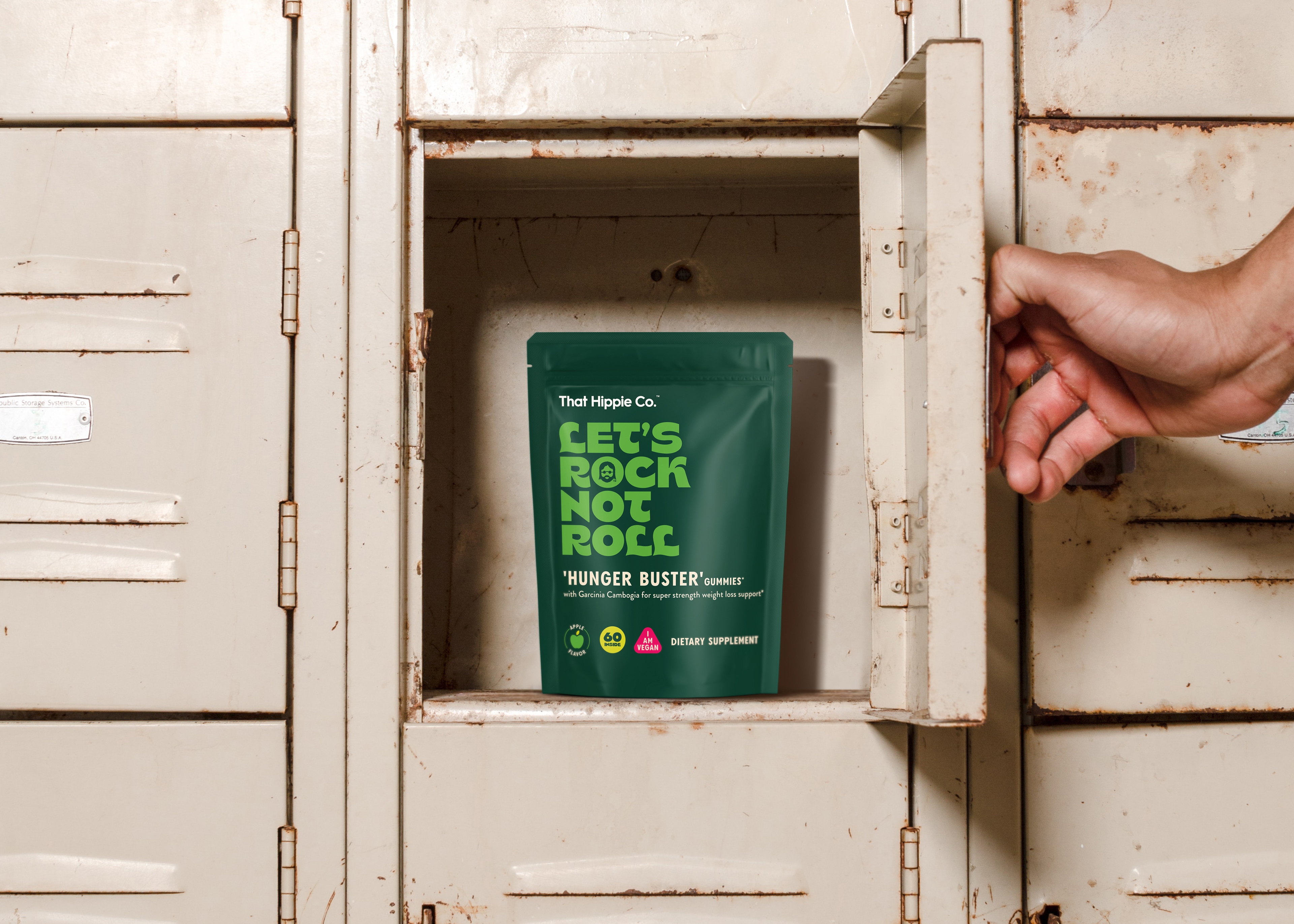 Hand opening a metal locker with “Hunger Buster” gummies by packaging design agency in Sydney Our Revolution for dietary supplement brand That Hippie Co.