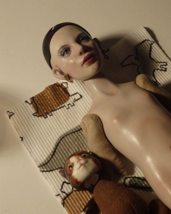 art doll with cat
