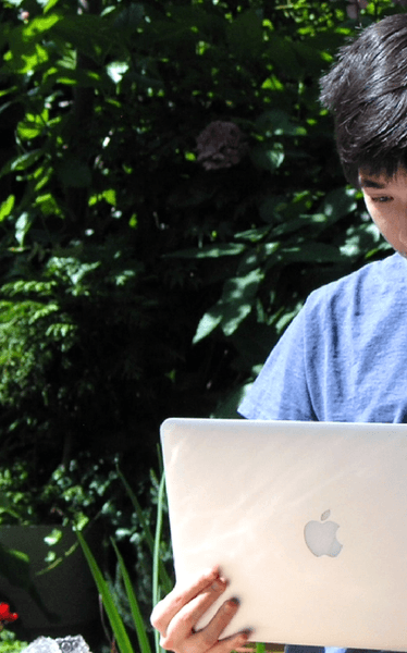 Stefano looking at a laptop
