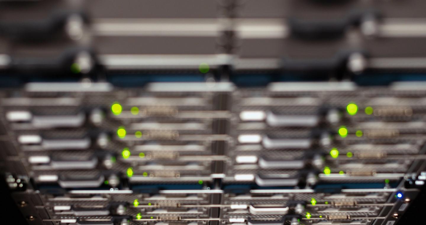 A close view of network equipment in a server rack.