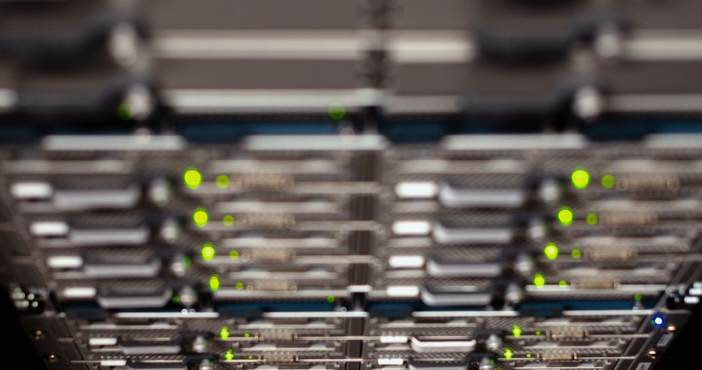 A close view of network equipment in a server rack.