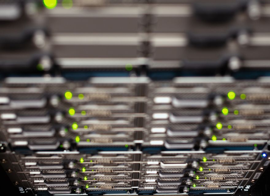 A close view of network equipment in a server rack.