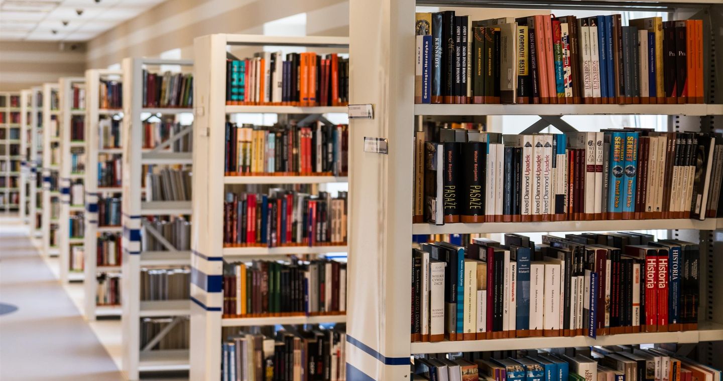 Rows of books arranged on library shelves.