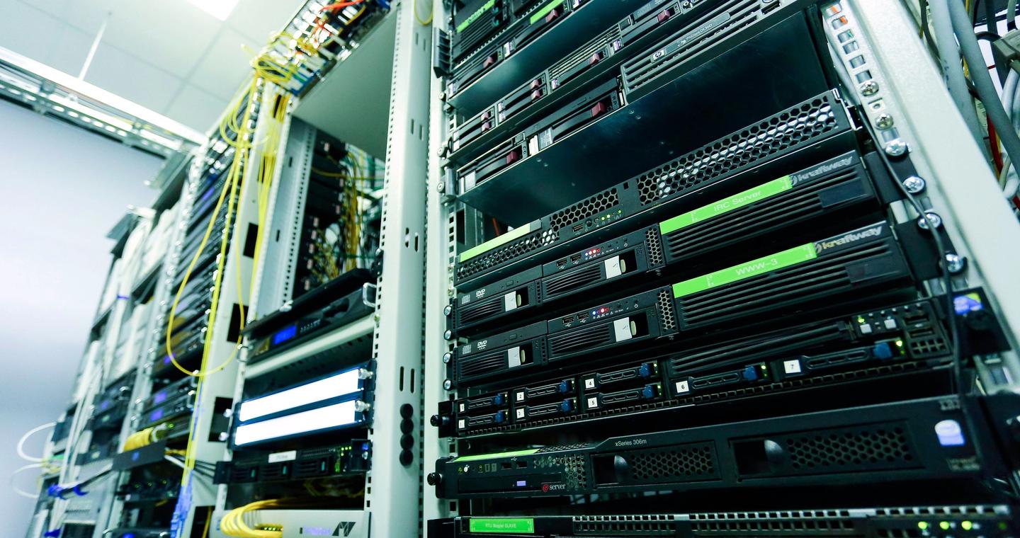 Network hardware and cables inside a server rack.