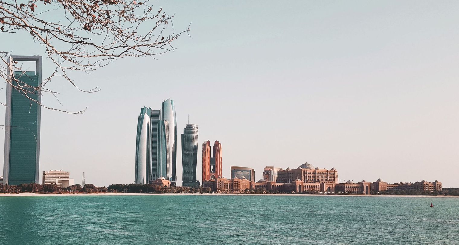 Abu Dhabi waterfront skyline by day, including the Etihad Towers