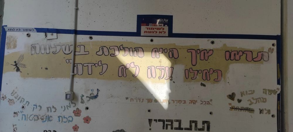 כ