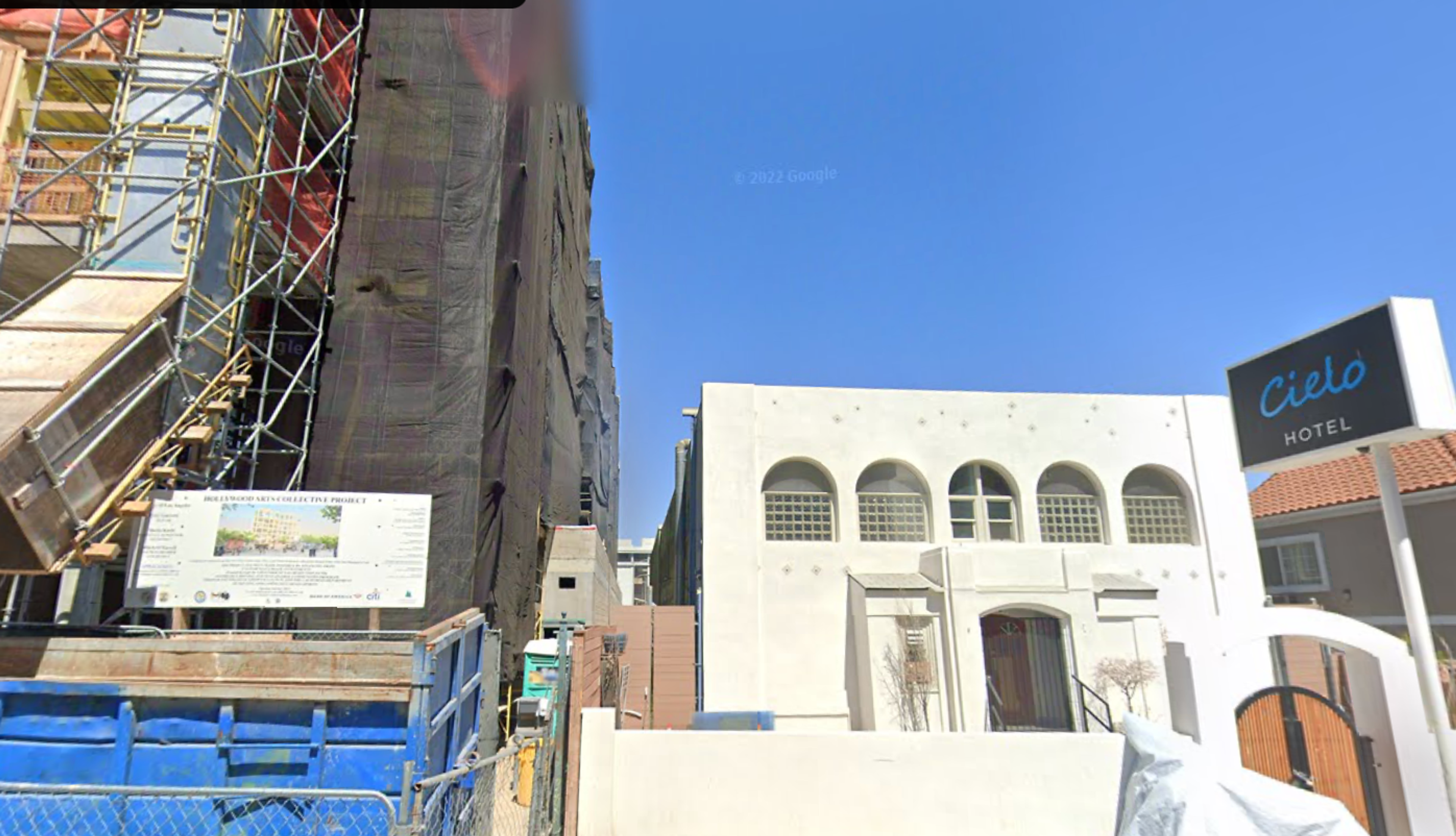 Picture of 7-story Hollywood Arts Collective under construction on the left, dwarfing two-story Cielo Hotel on the right.