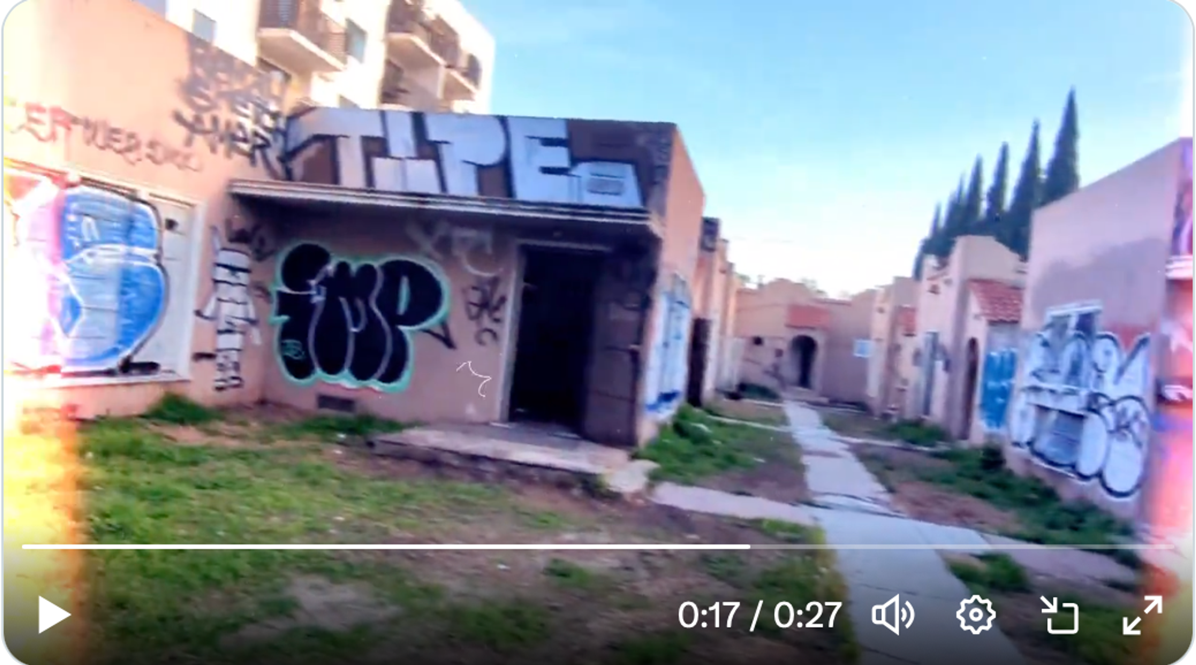 Screenshot of video clip showing the 7 heavily vandalized bungalow units at 5212 Melrose.