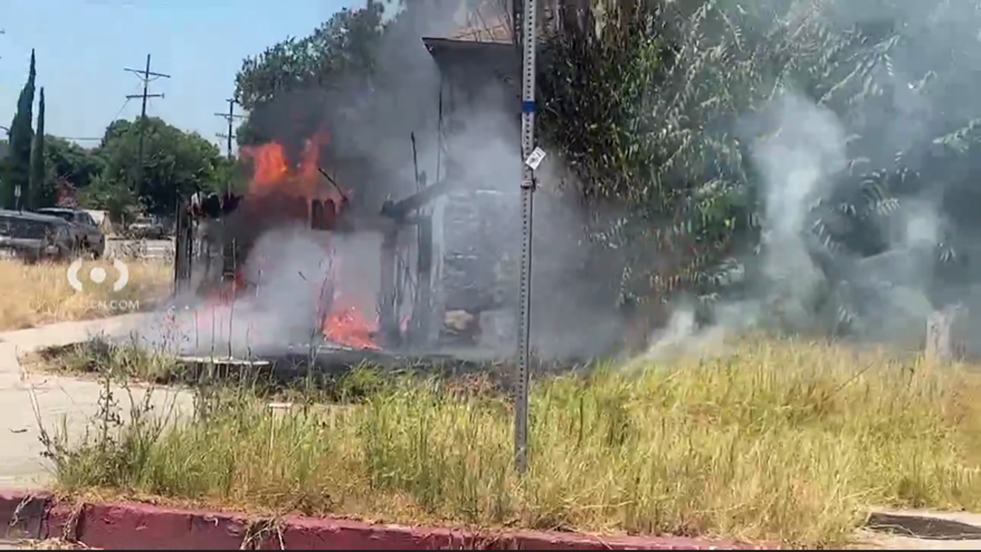 6401 Camellia Avenue, a 1940 single-story bungalow, on fire.