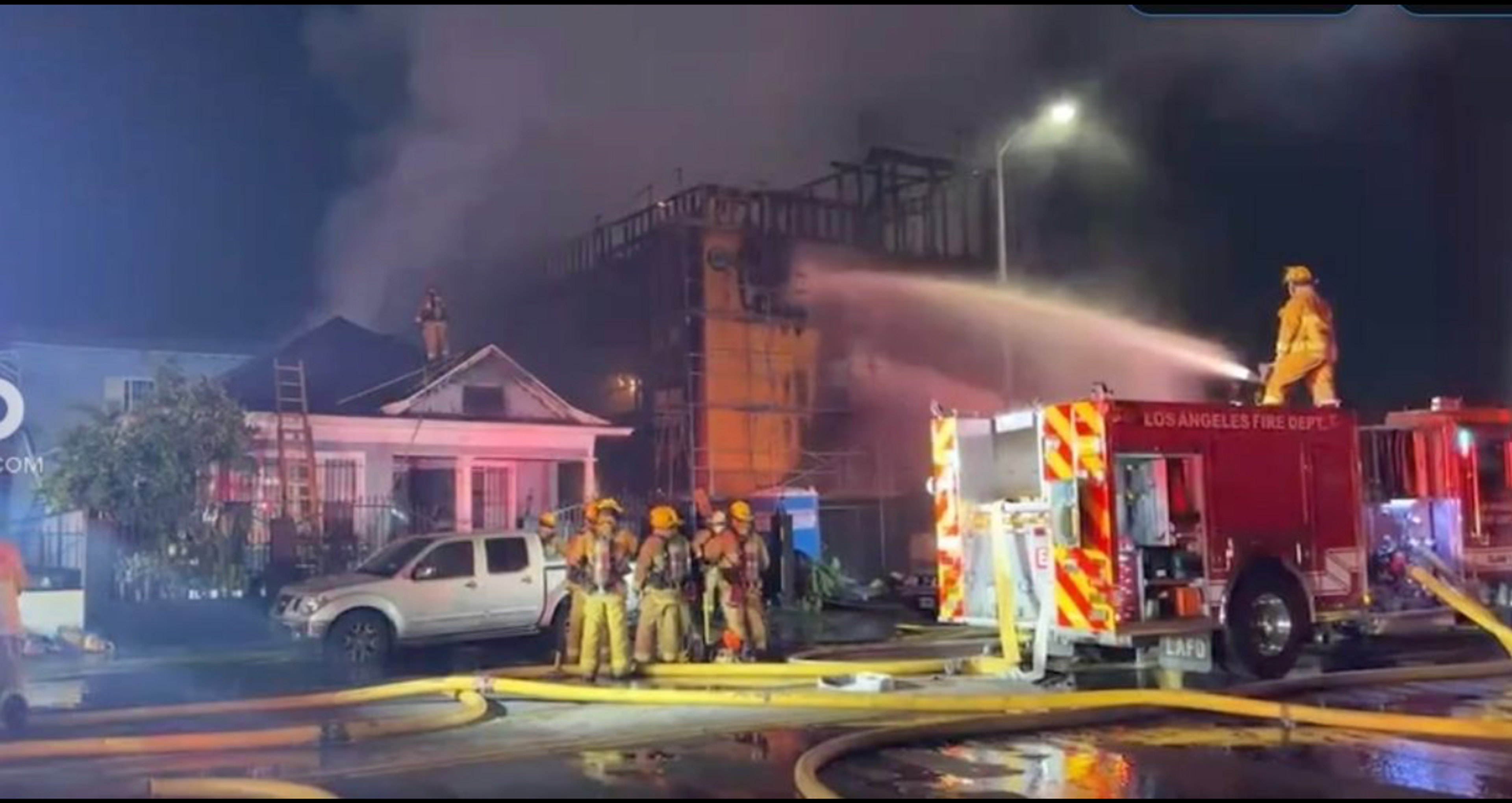 217 E. Vernon, a three-story wood framed building under construction, being extinguished by firefighters.