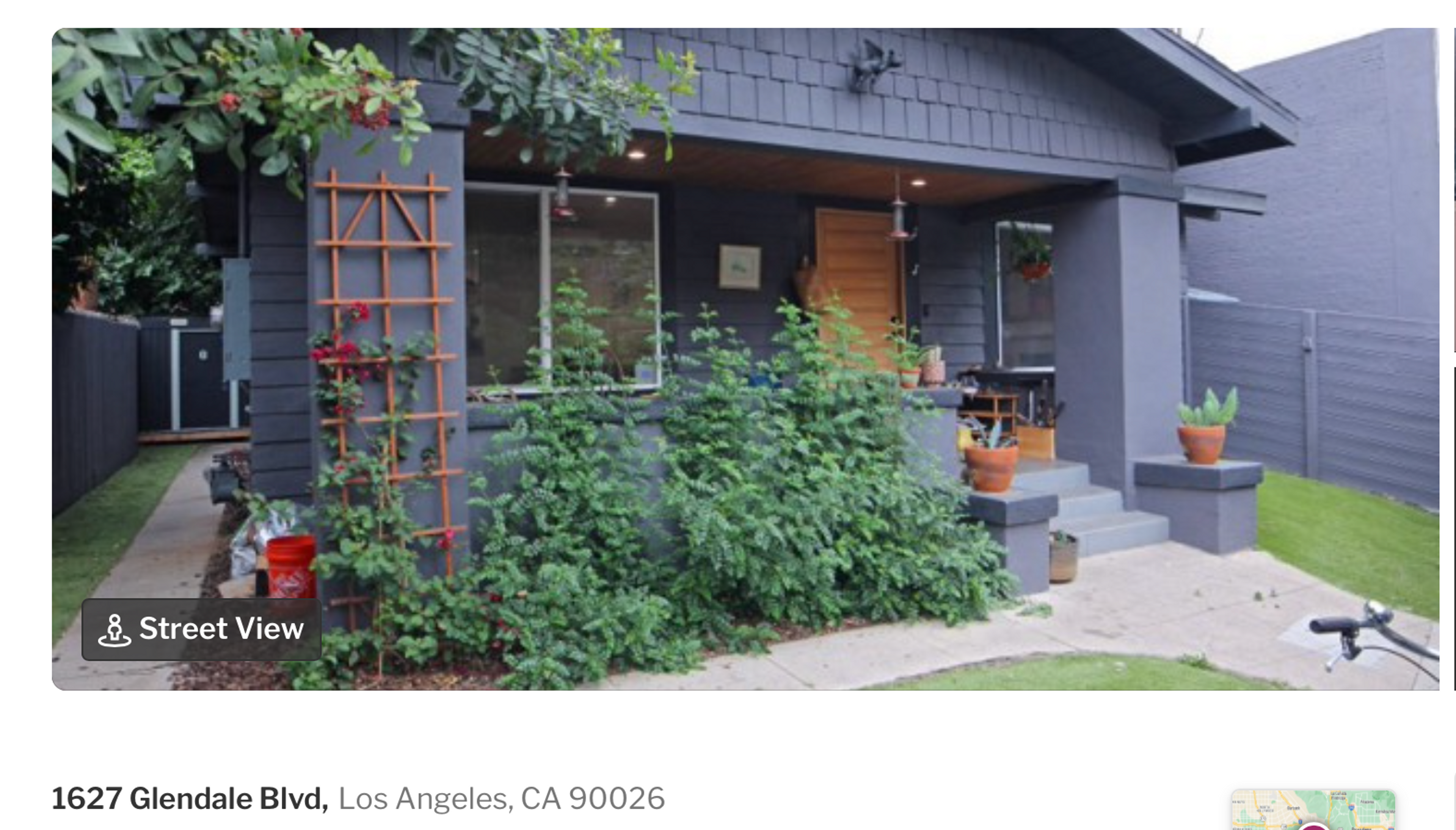 Redfin listing photo of 1627 Glendale Boulevard, a gray Craftsman bungalow that has been extensively repaired.