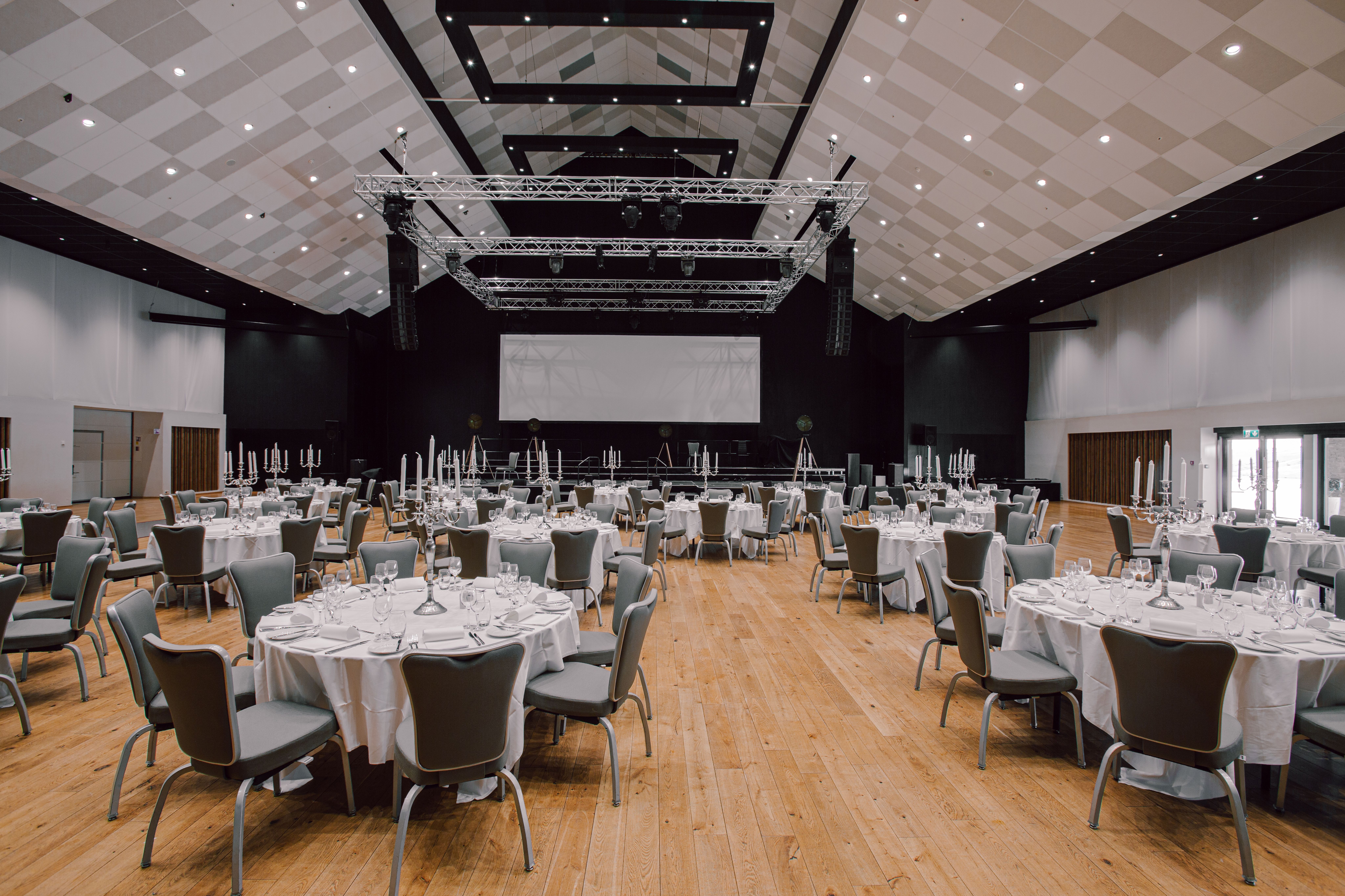Many round tables set for feast in our largest hall; The Panorama hall
