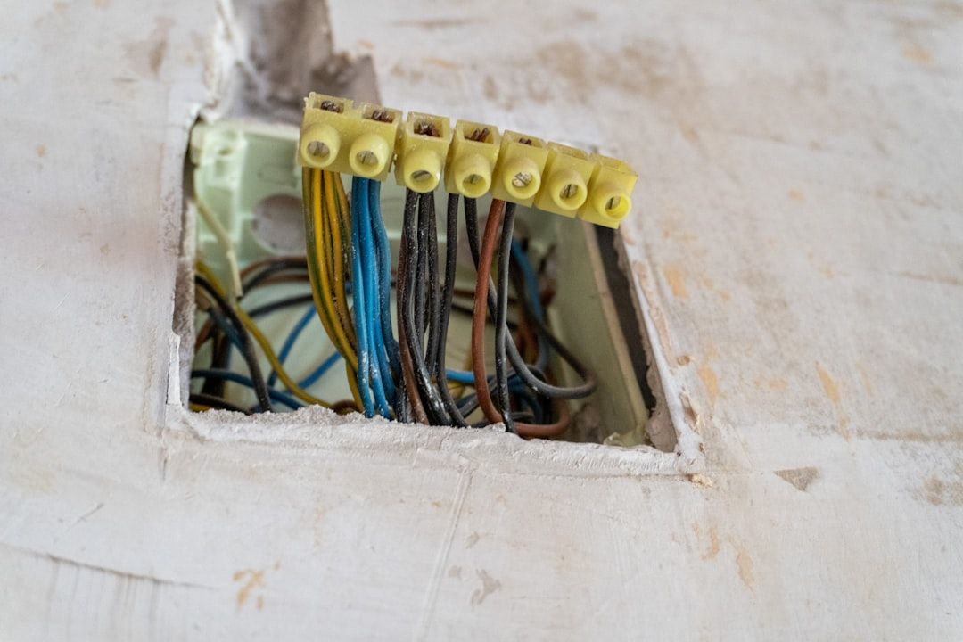 Electrical wires connected with yellow terminal blocks.
