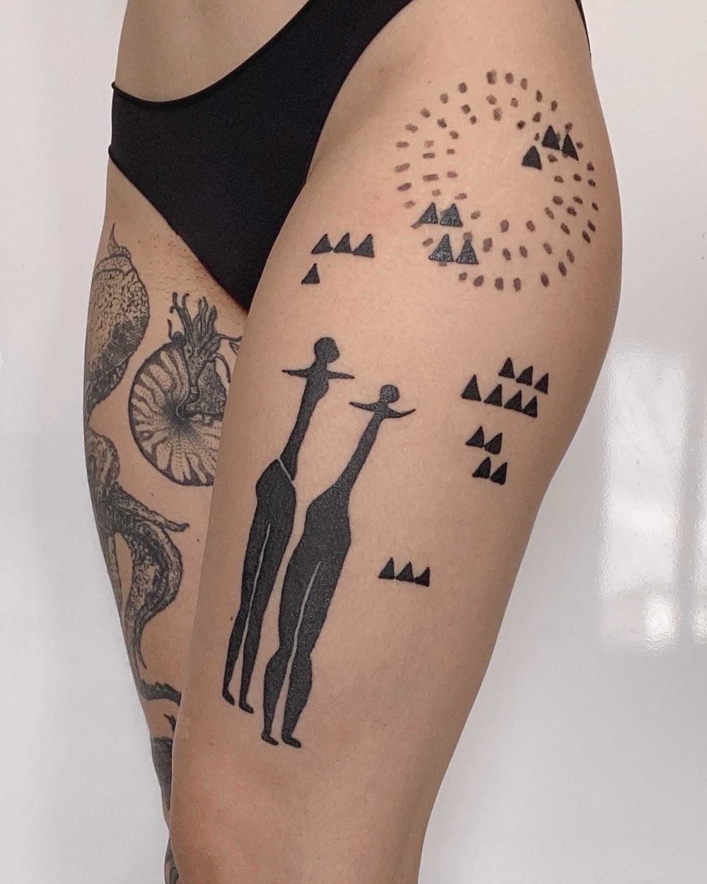ornamets_petroglyph_leg_tattoo