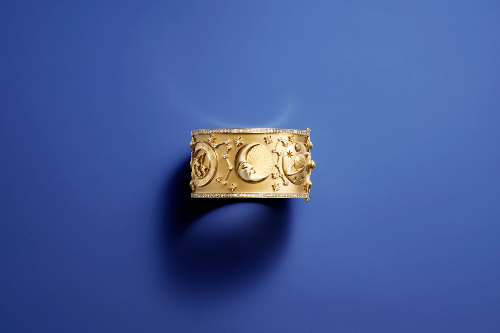 golden cuff with celestial motifs