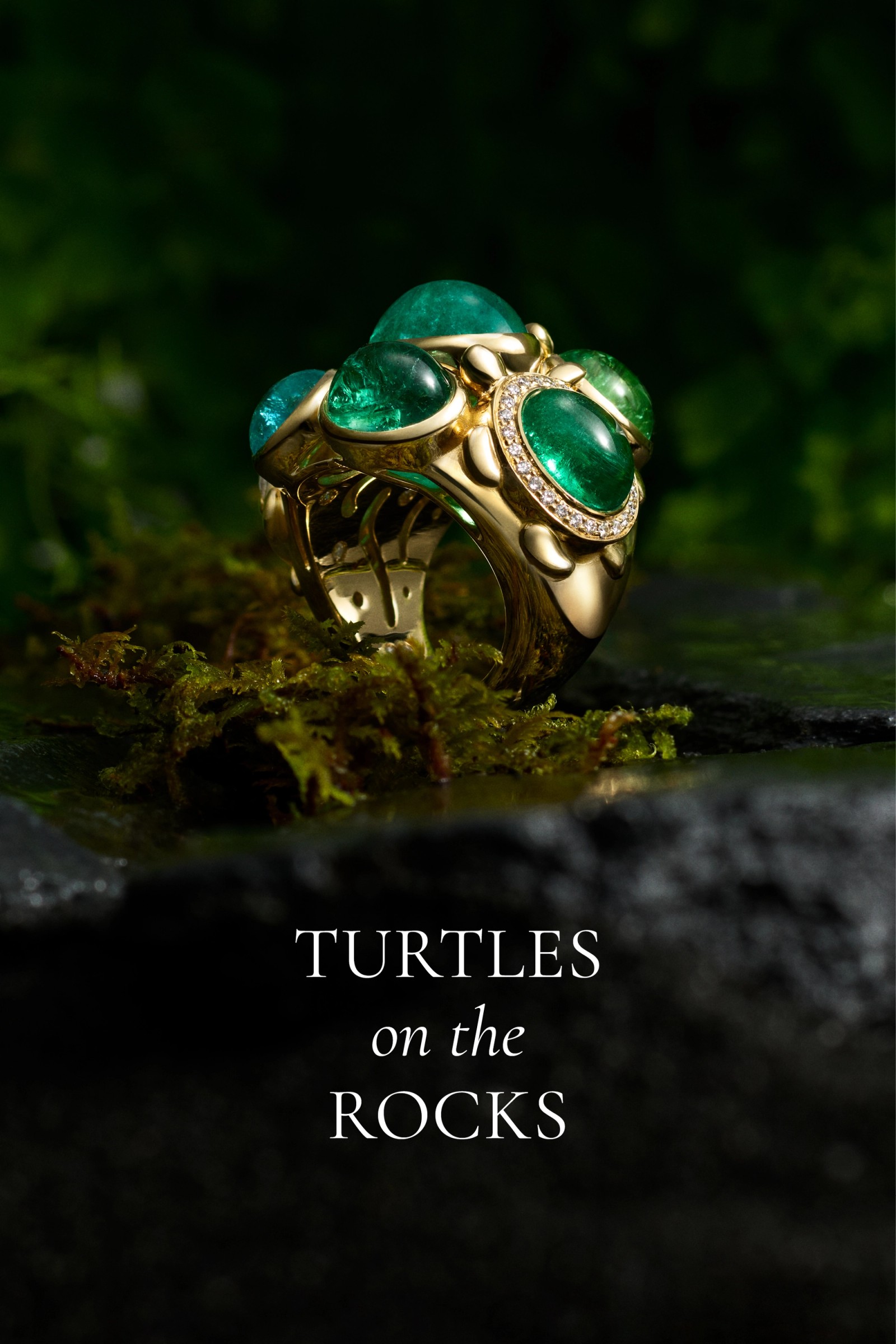 Gold ring with multiple paraiba cabochons and diamond accents, resting on moss.
