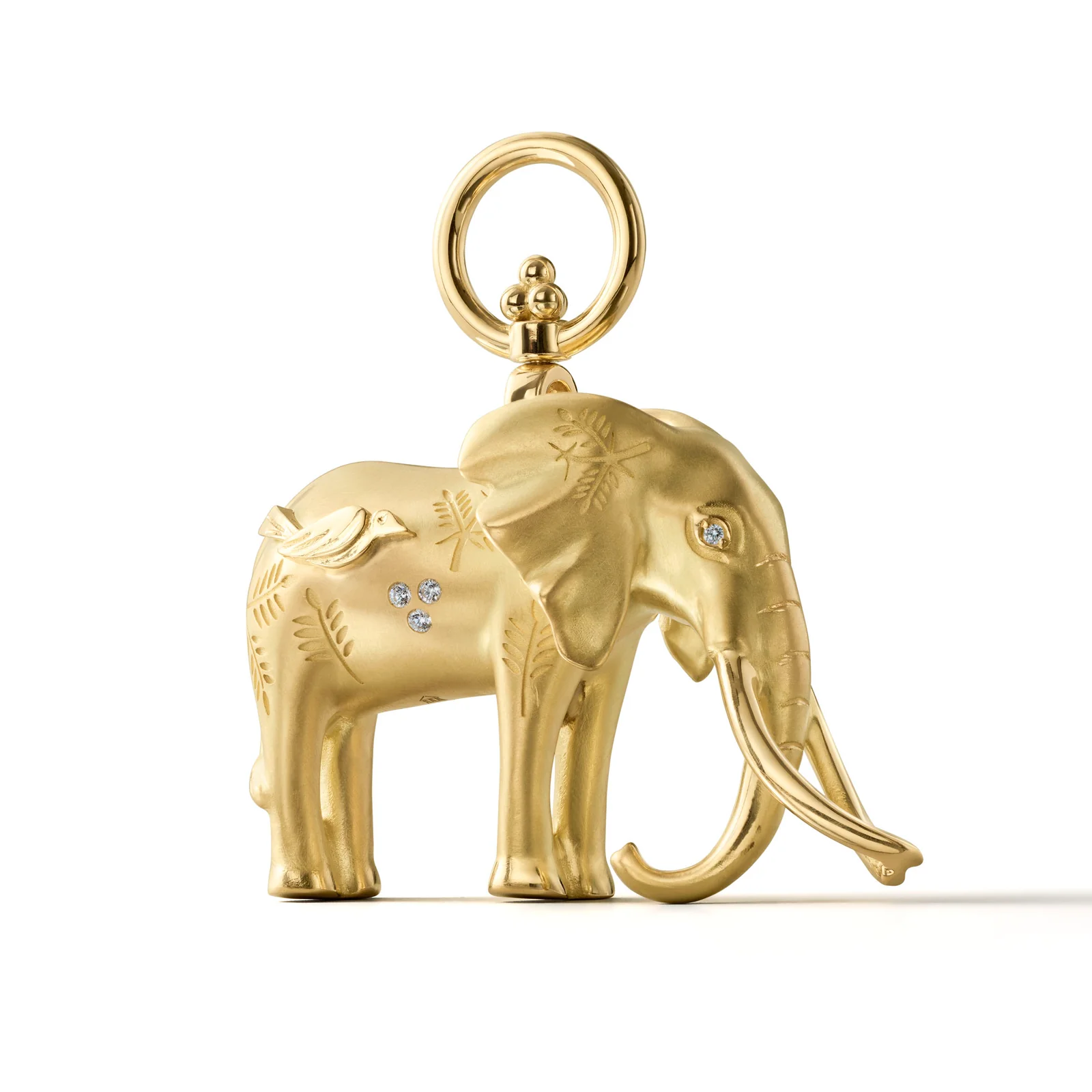 Matte gold elephant pendant with etched patterns, a bird, and diamond accents.