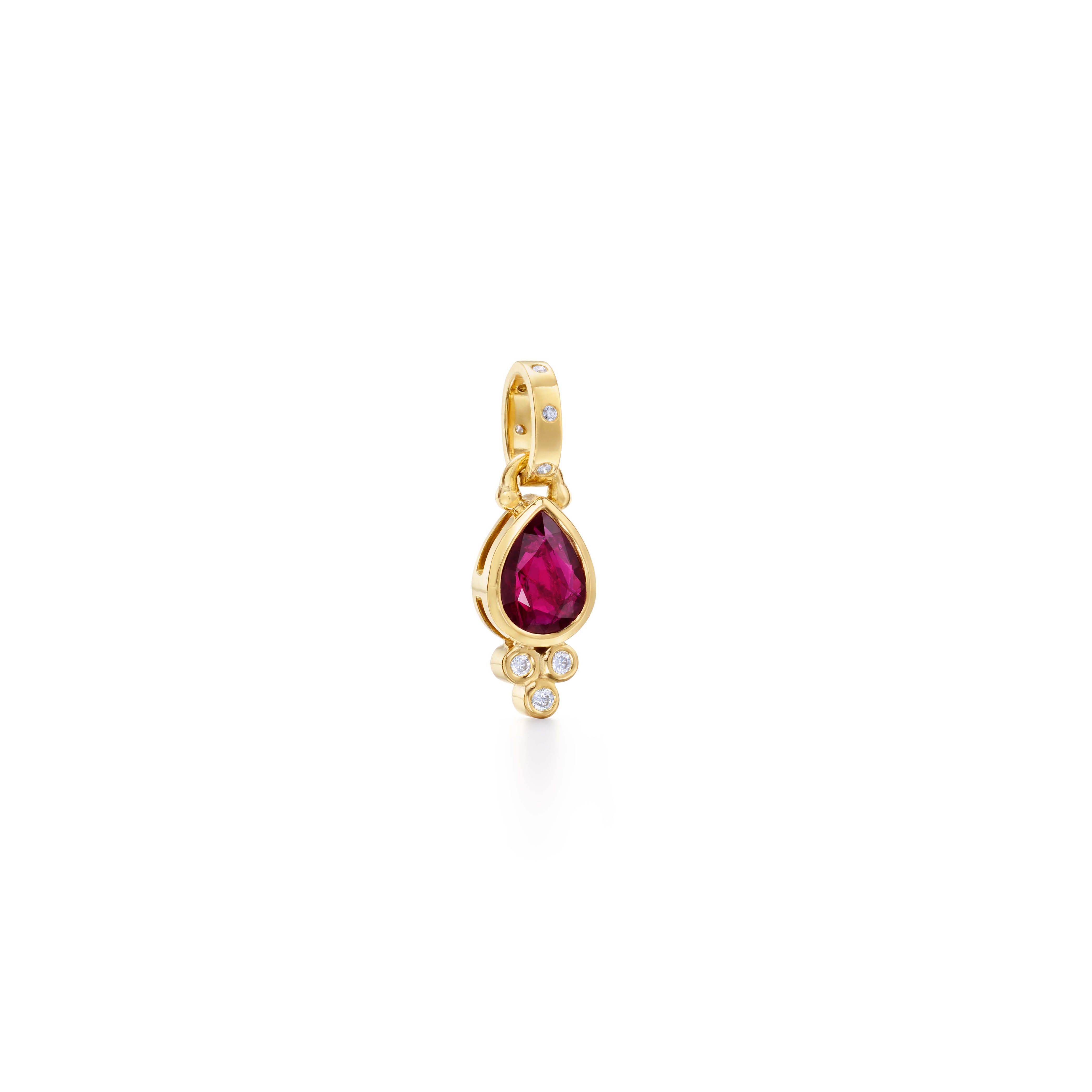 Gold pendant with a pear-shaped ruby and diamond accents.