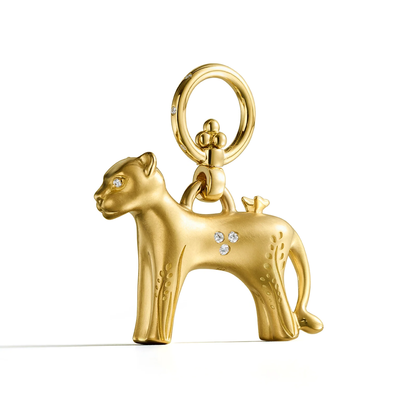 Gold elephant charm with leaf engravings, diamond eye, and a bird on its back.