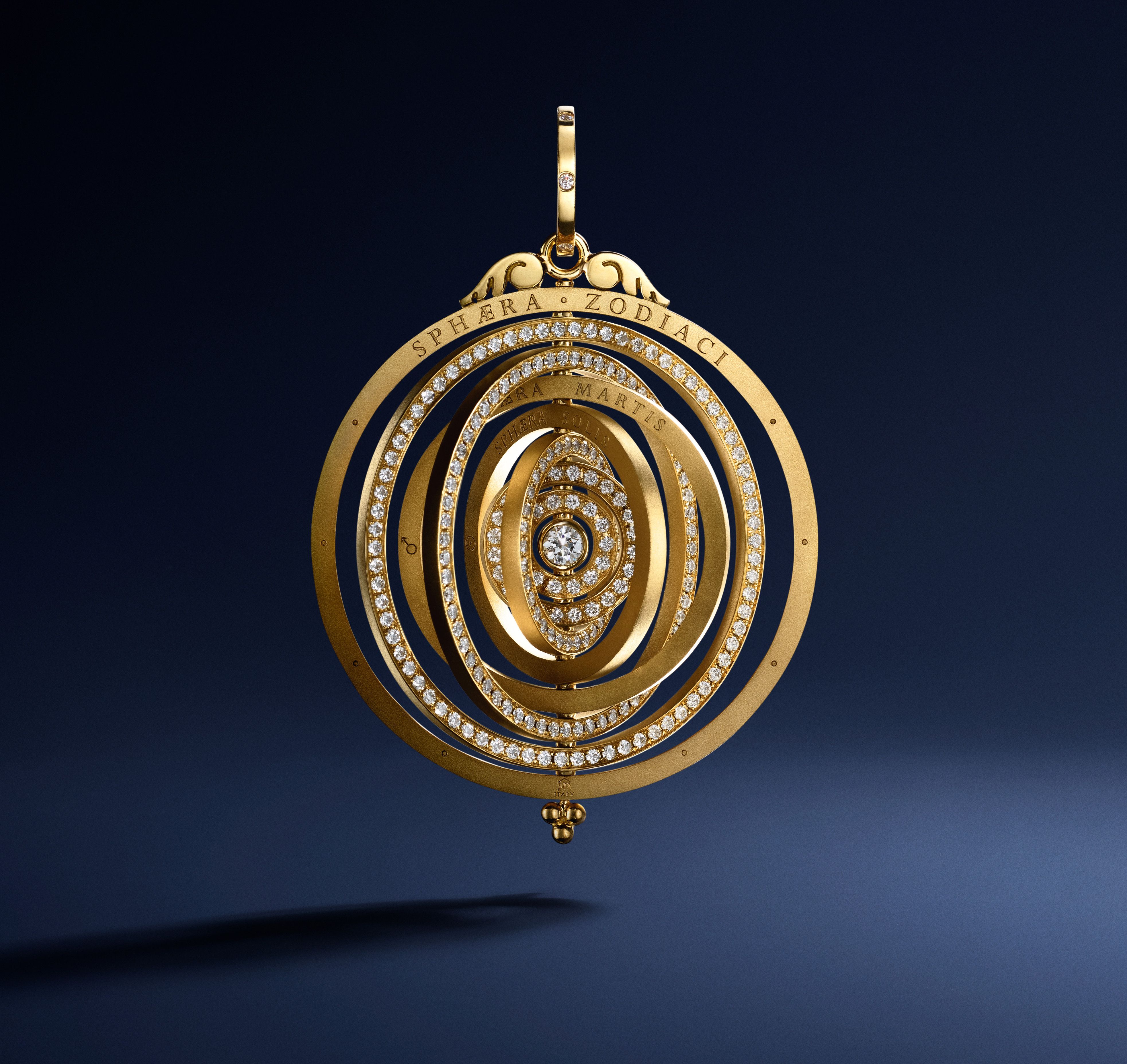 Gold armillary sphere pendant studded with numerous diamonds.