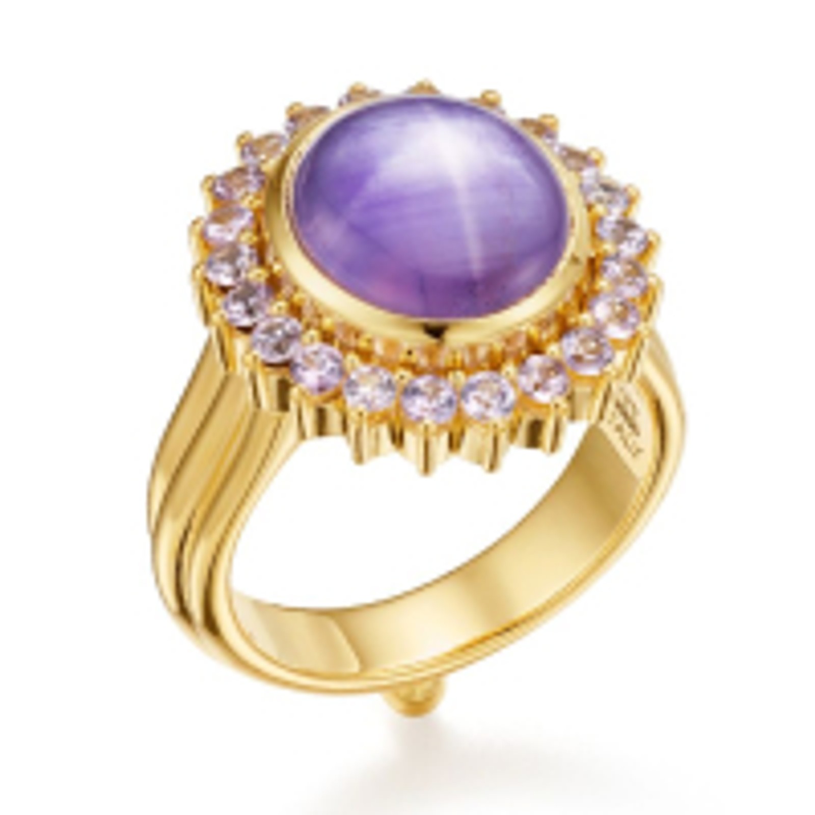 Gold ring with an oval purple star sapphire surrounded by smaller purple gemstones.