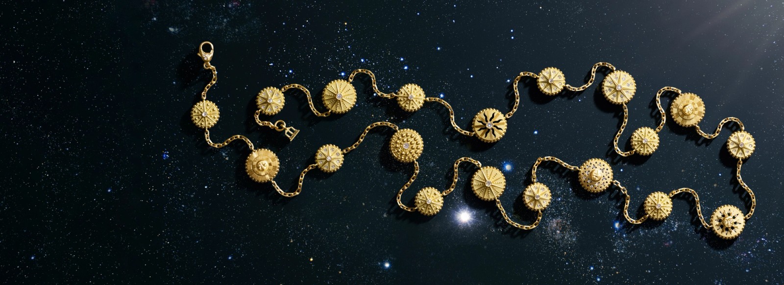 A gold necklace with celestial-themed circular charms on a dark, starry background.
