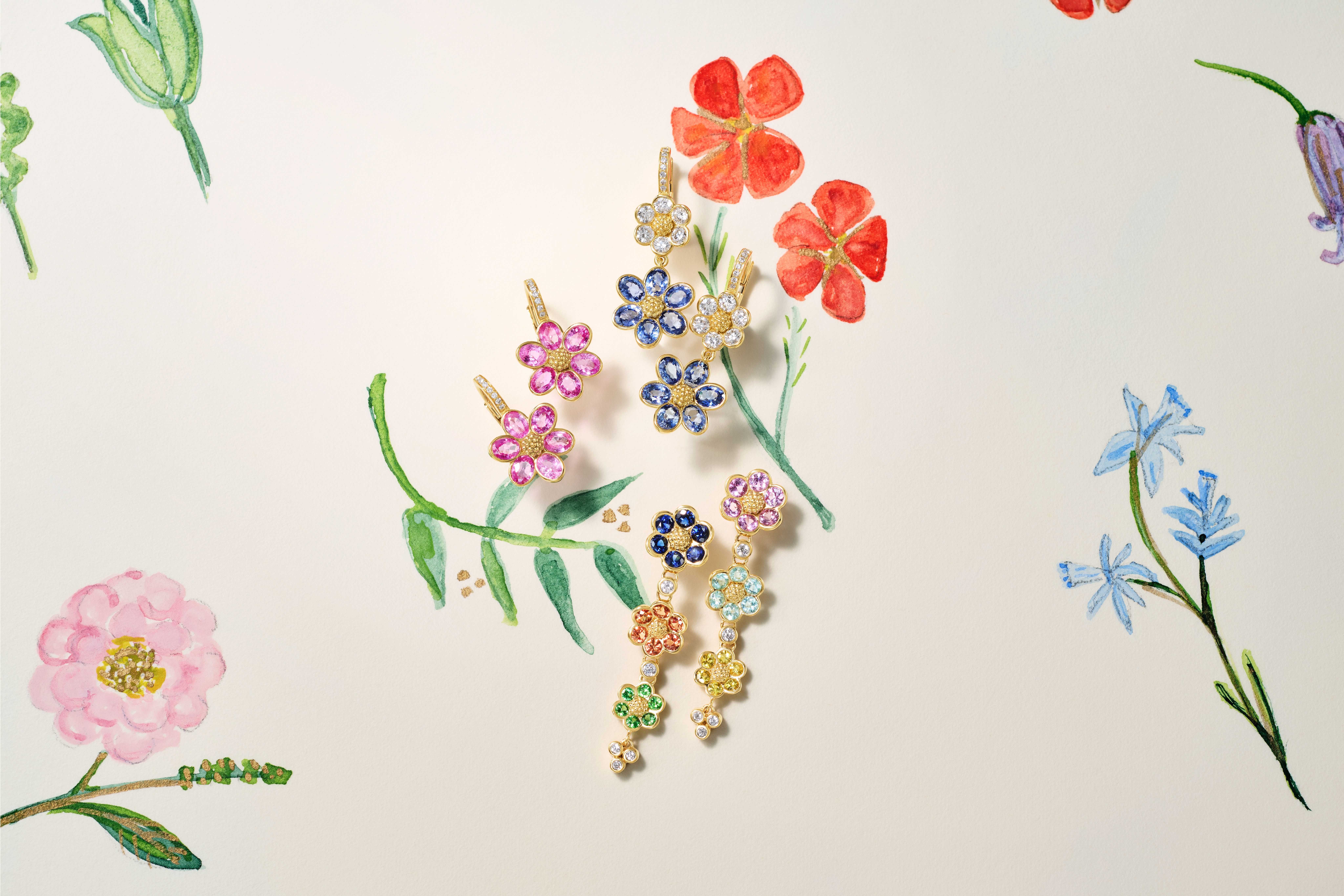 Floral gemstone jewelry, including earrings and dangle earrings, on a cream background with watercolor flower illustrations.