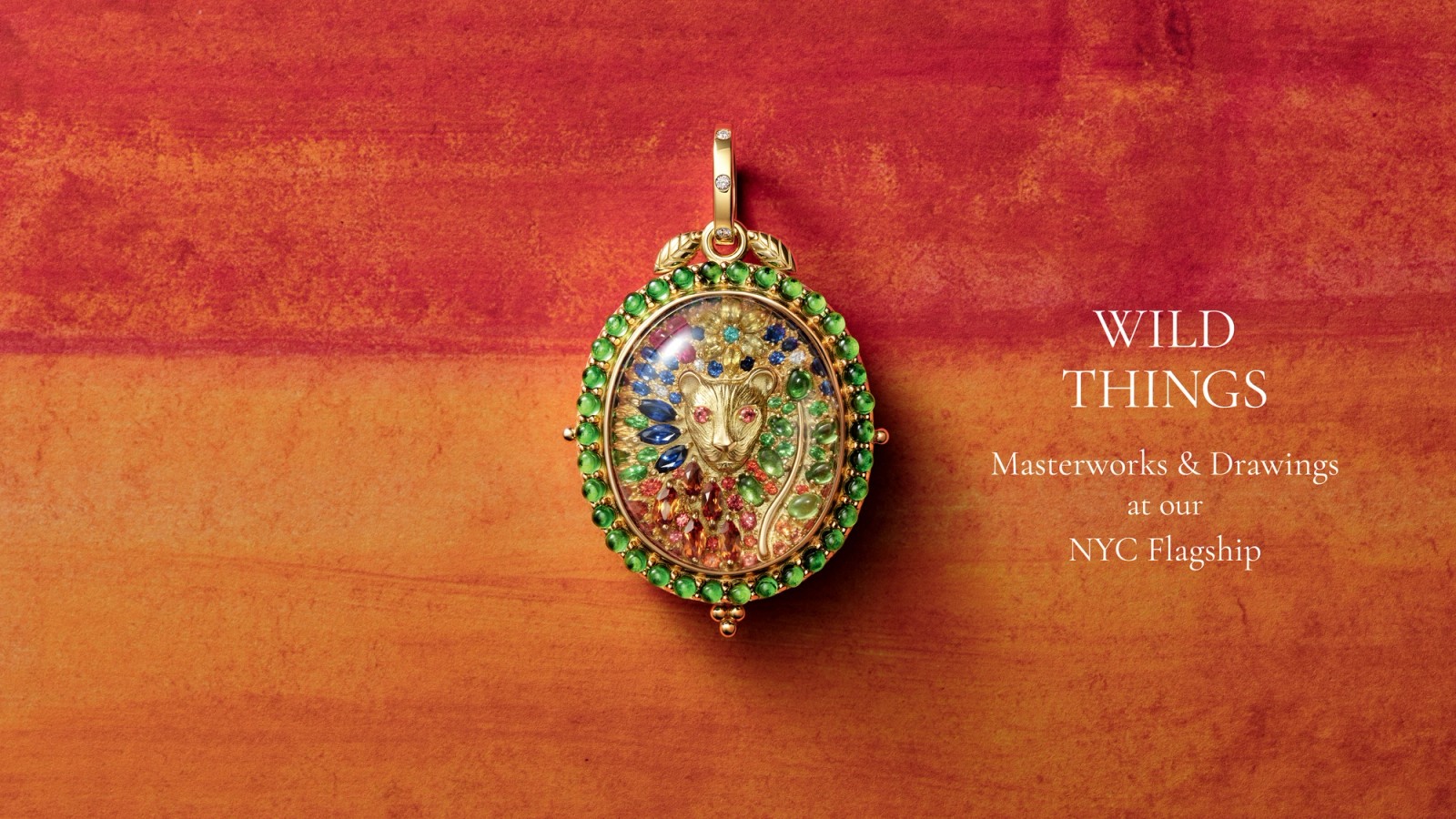 Ornate gold pendant featuring a lion's head crafted from colorful gemstones, with text 'WILD THINGS Masterworks & Drawings'.