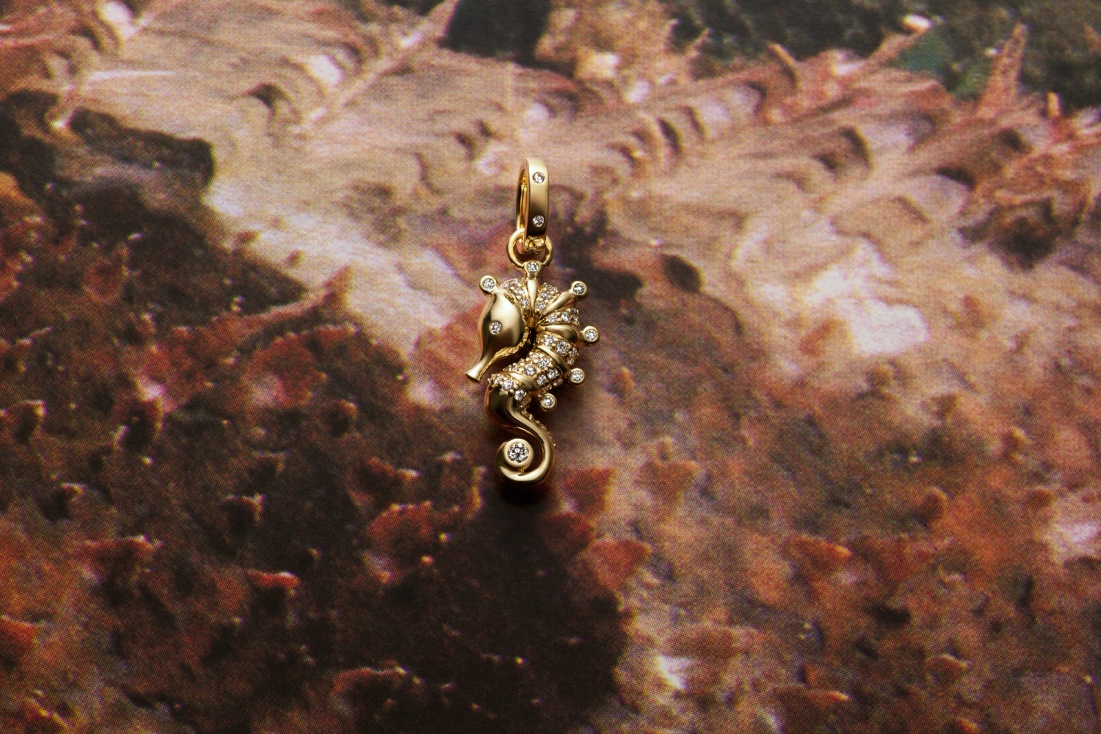 Diamond-encrusted gold seahorse pendant.