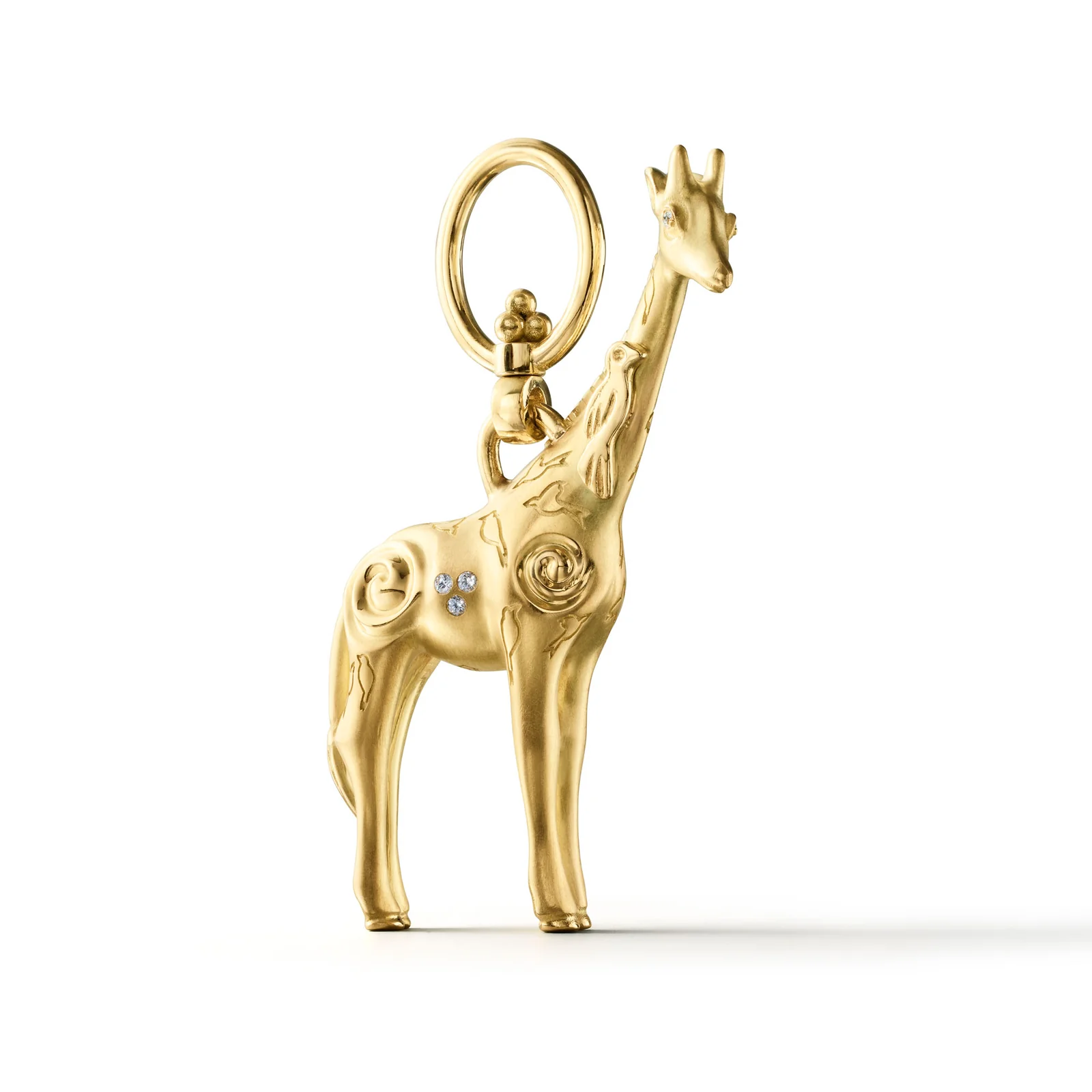 Golden giraffe charm with intricate swirling patterns, diamonds on its body and head, and a top loop.