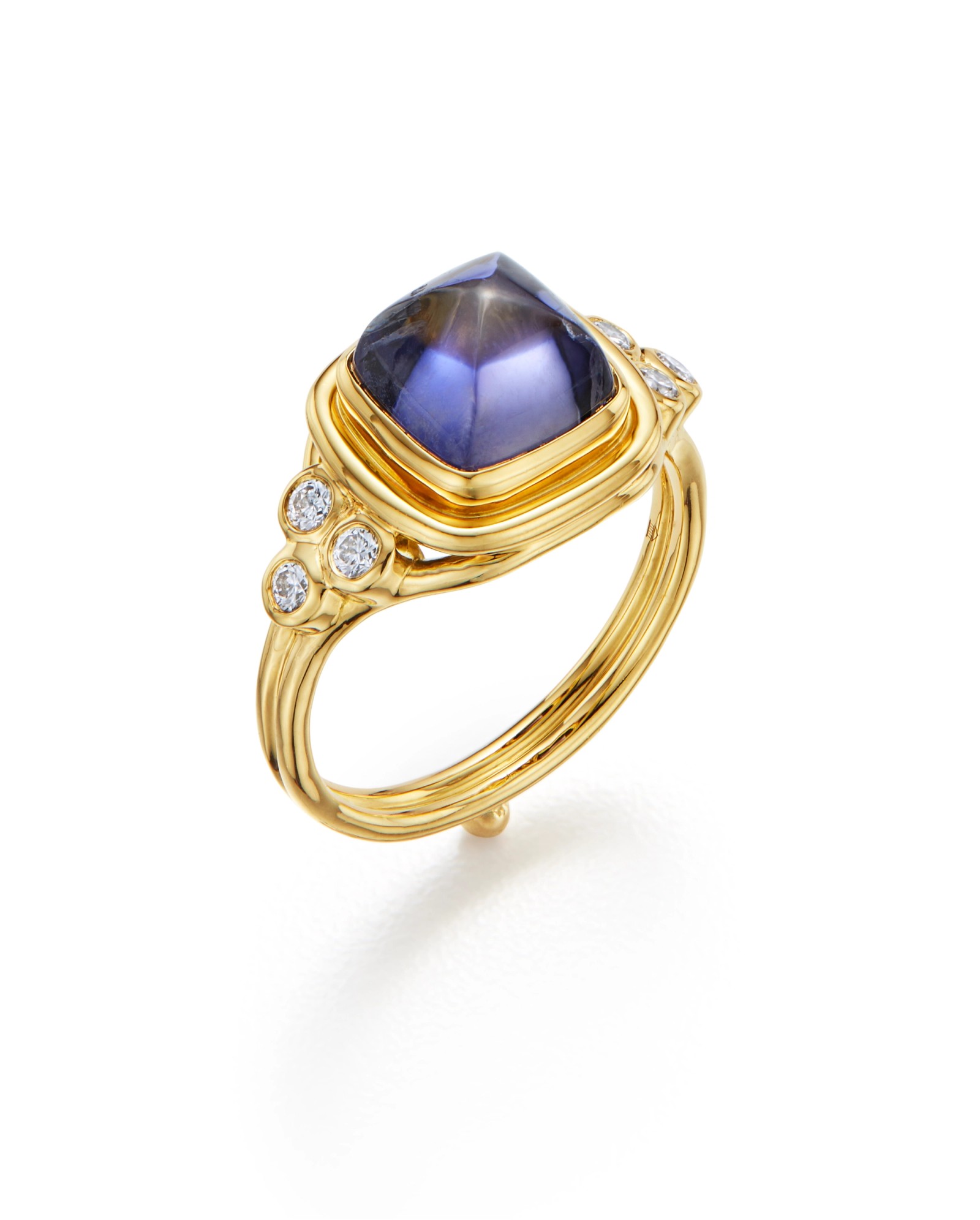 Gold ring with a central cushion-cut purple gemstone and six round diamonds.