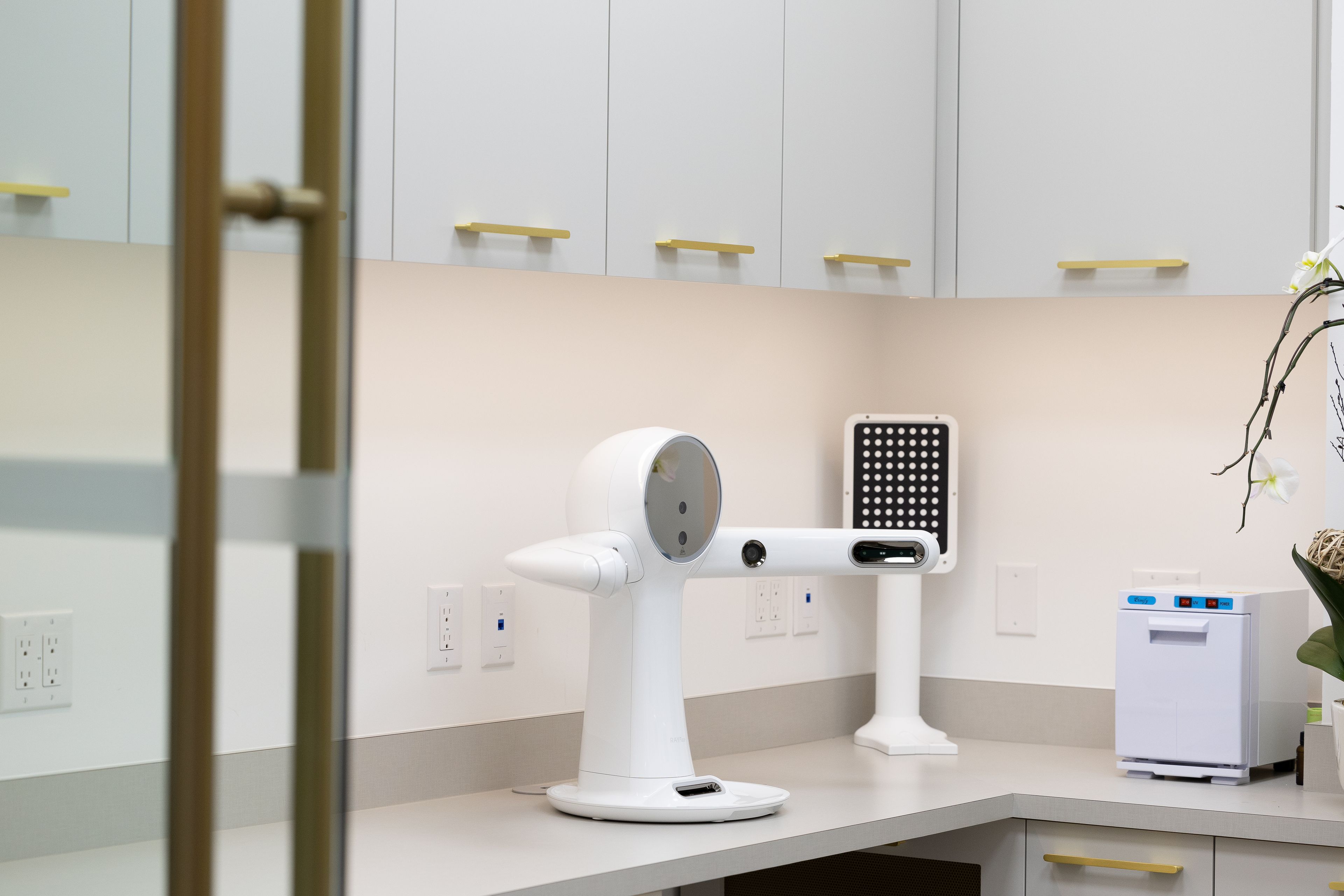 A futuristic augmented reality 3D face scanner tech device sitting on a workbench.