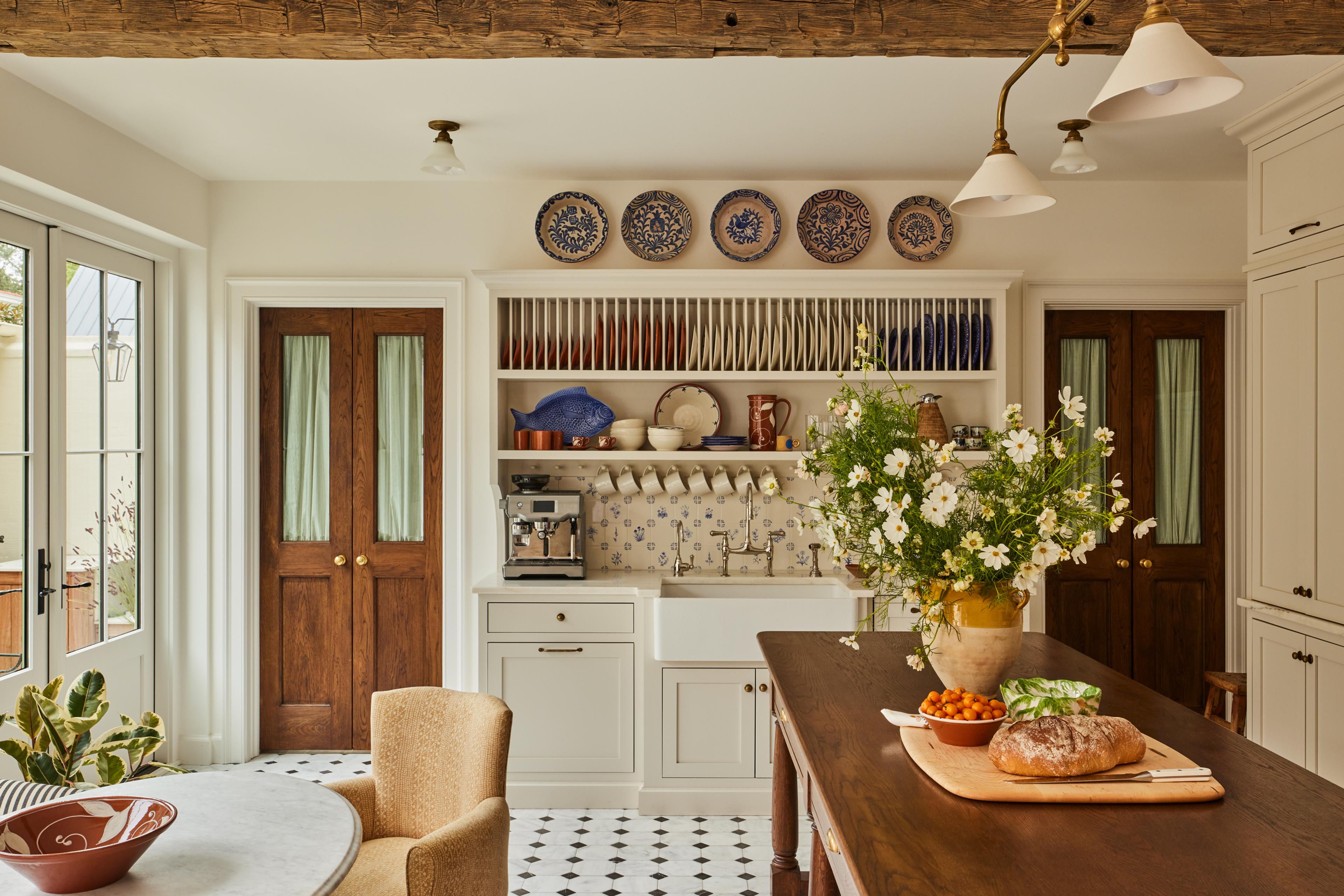 white kitchen with wooden center table