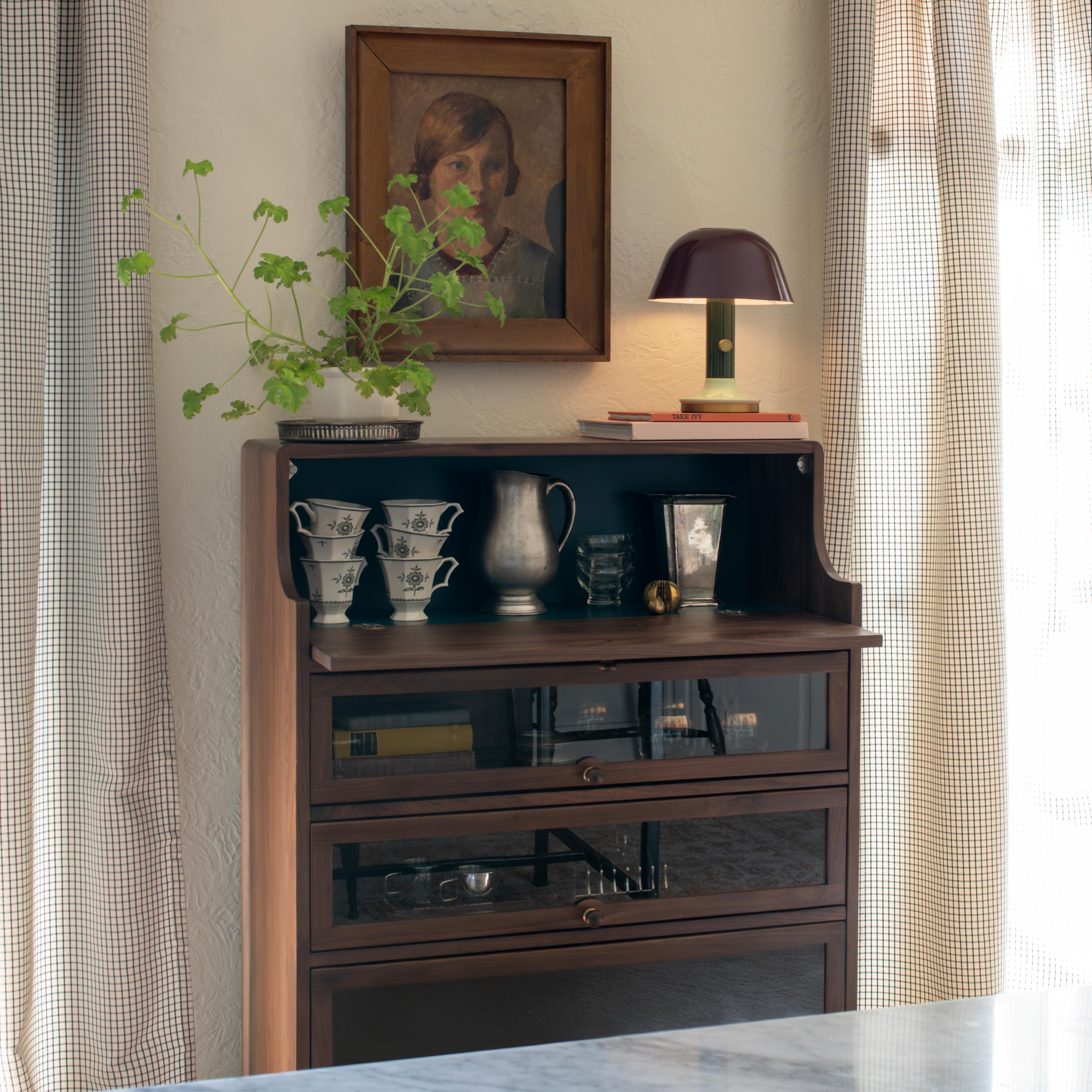 Barrister cabinet styled with glasses and a lamp. 