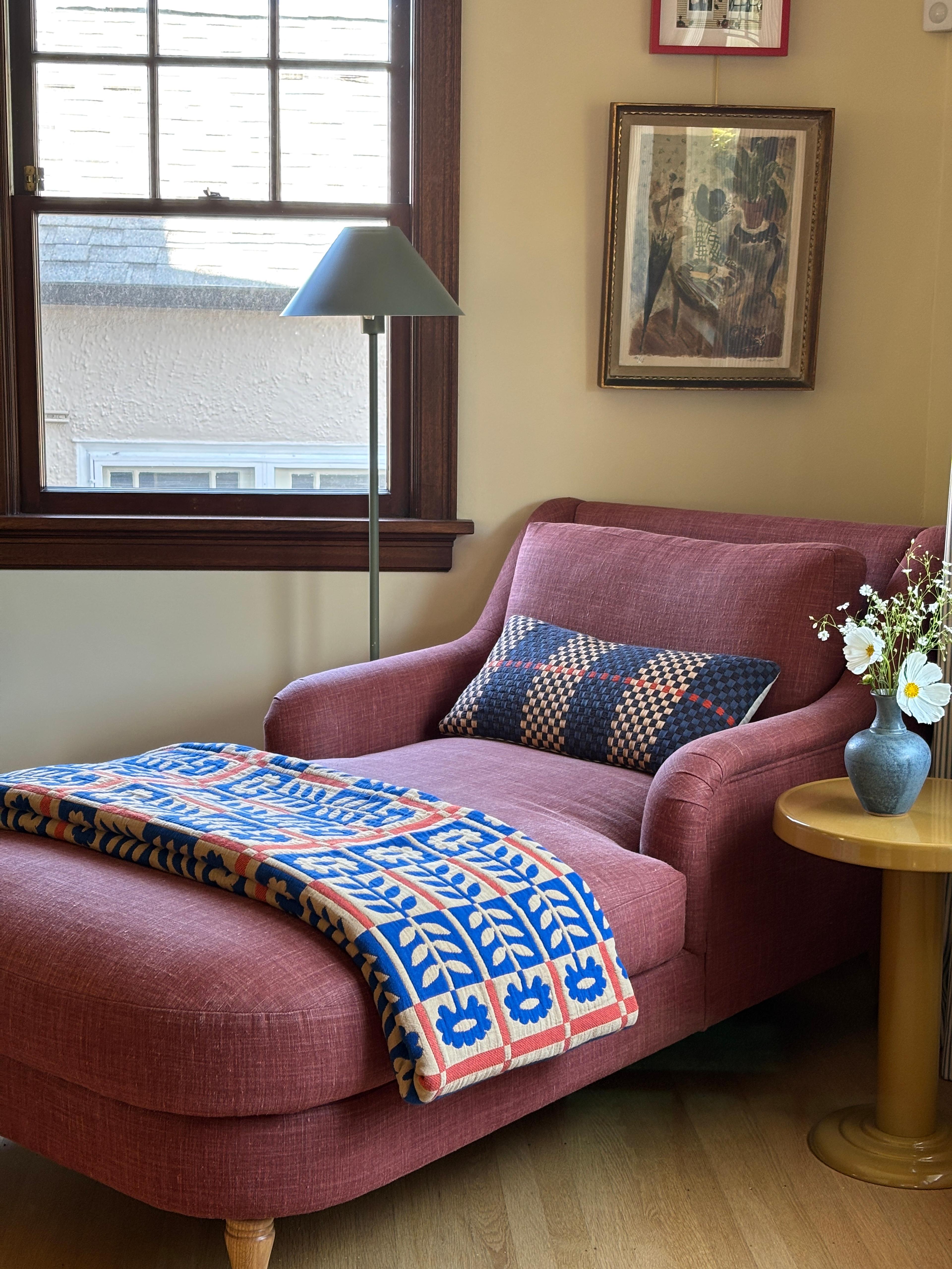 Quilt on chaise. 