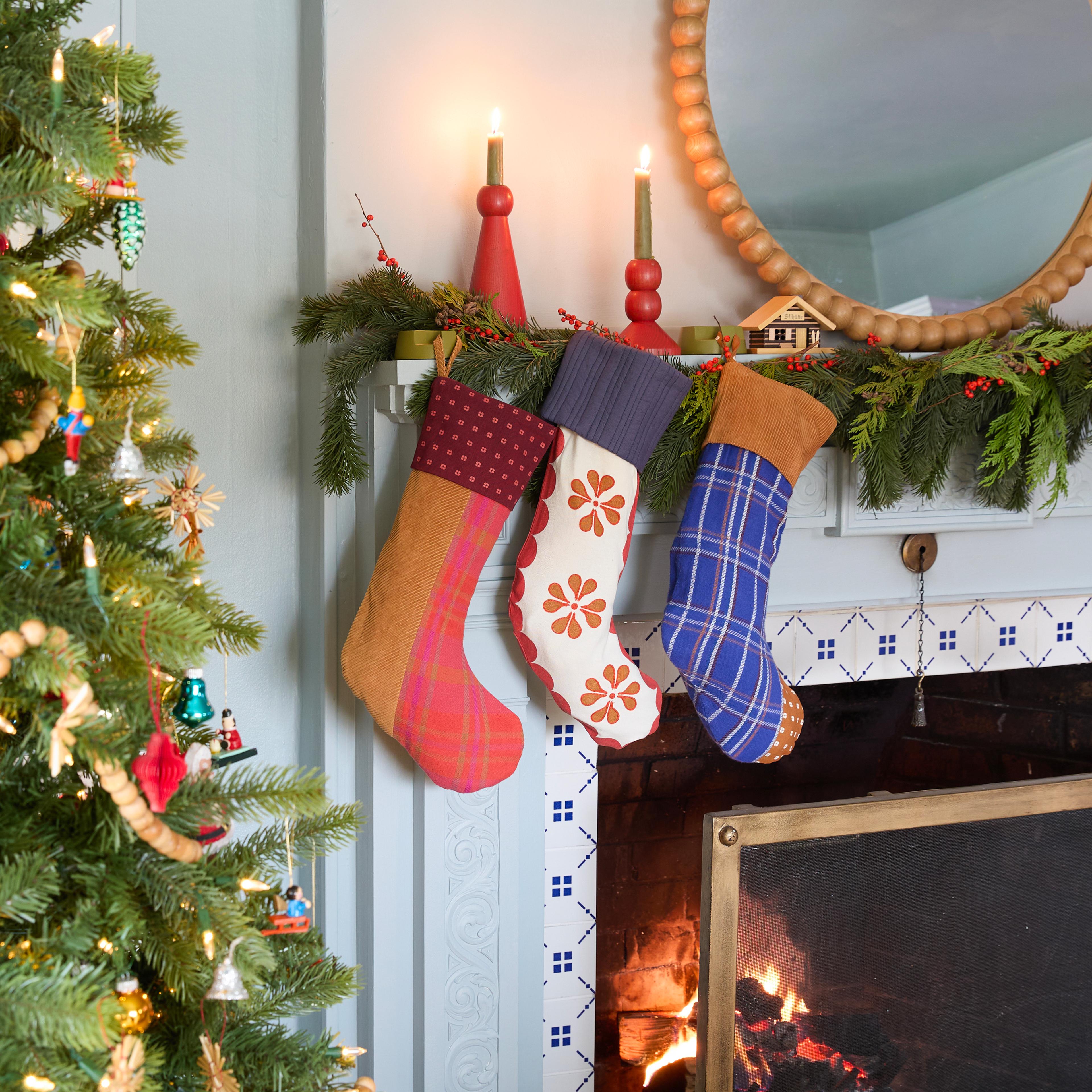 Holiday mantel with stockings. 