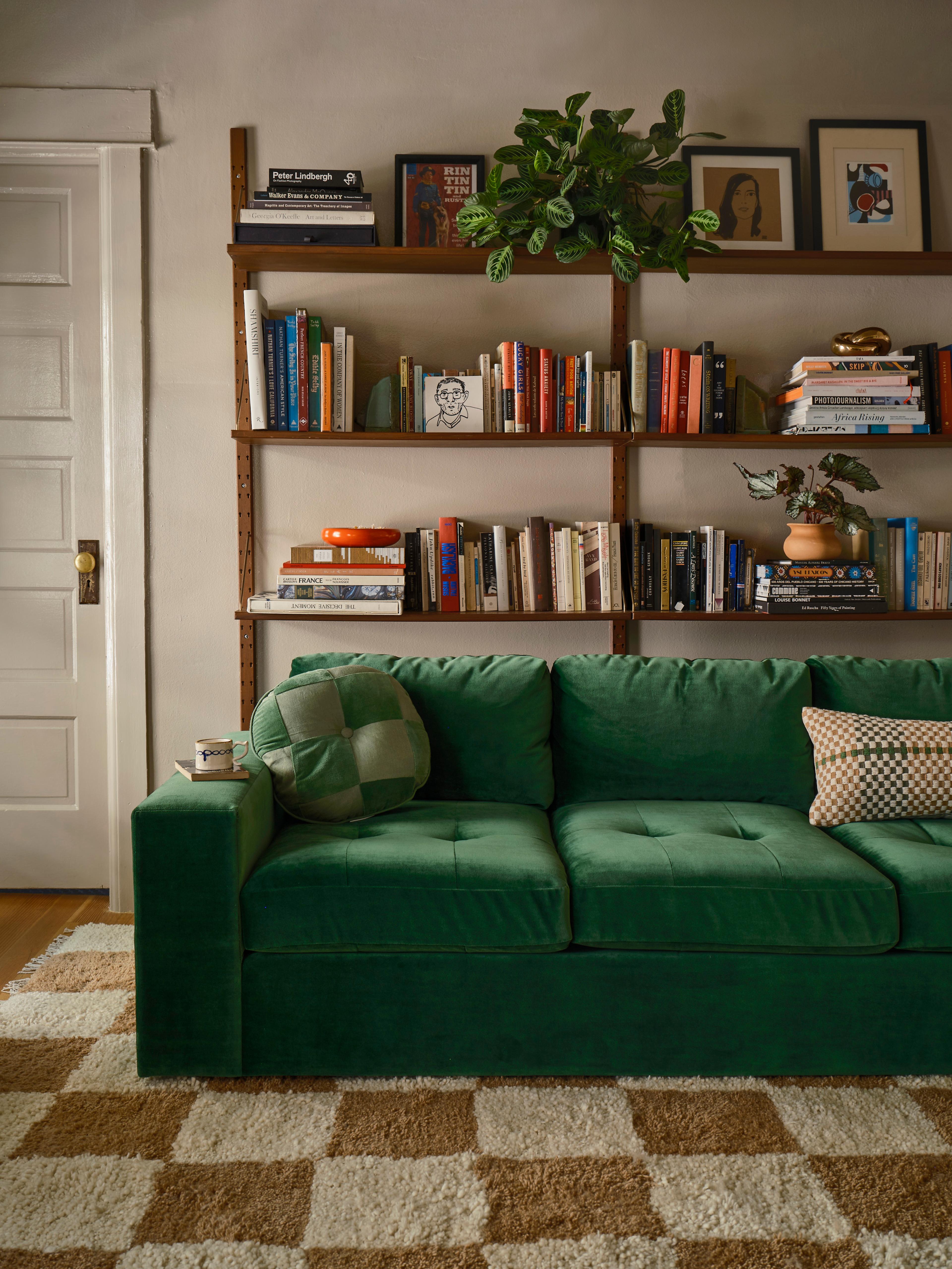 Emerald green sofa in living room.