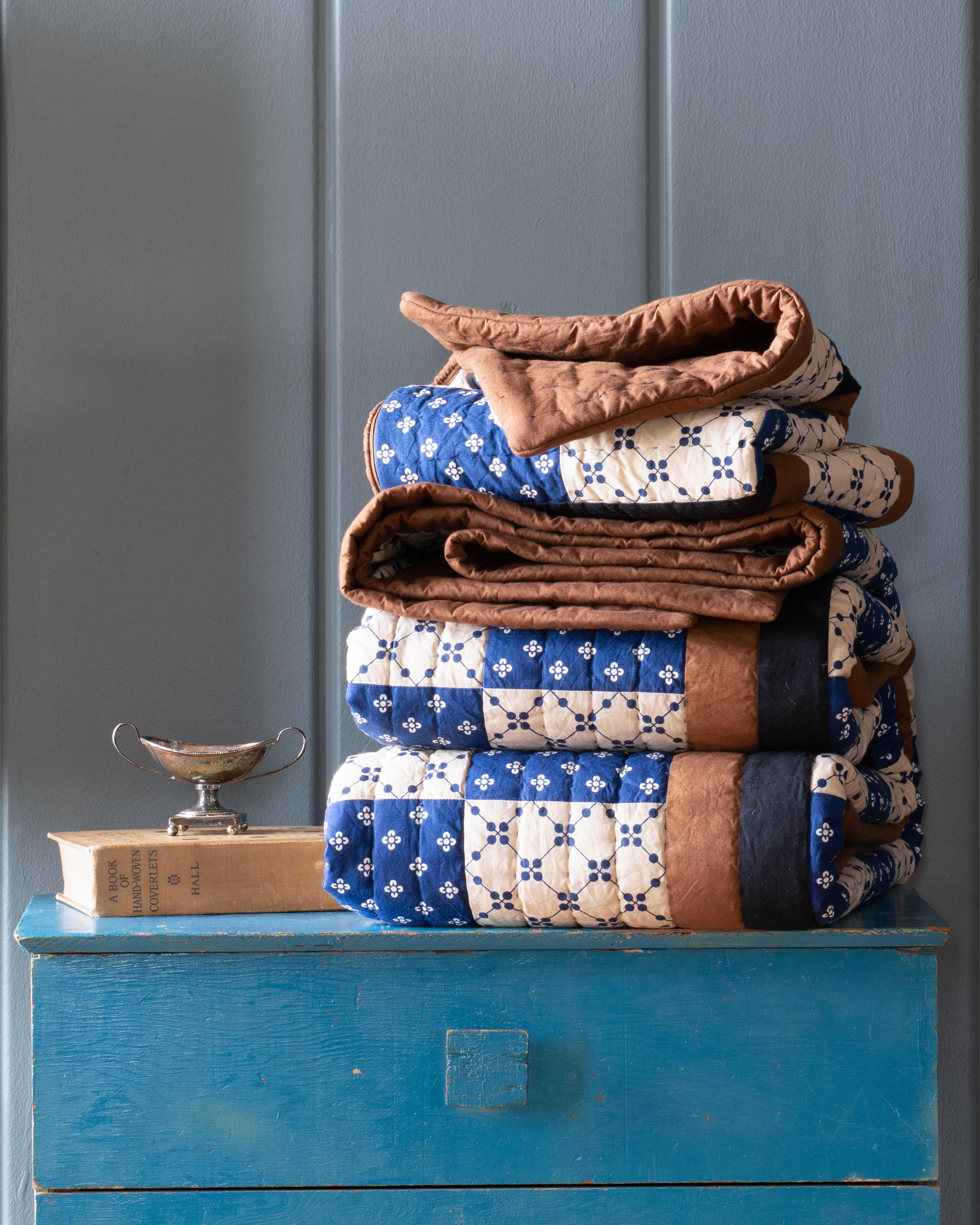 Quilt on dresser.