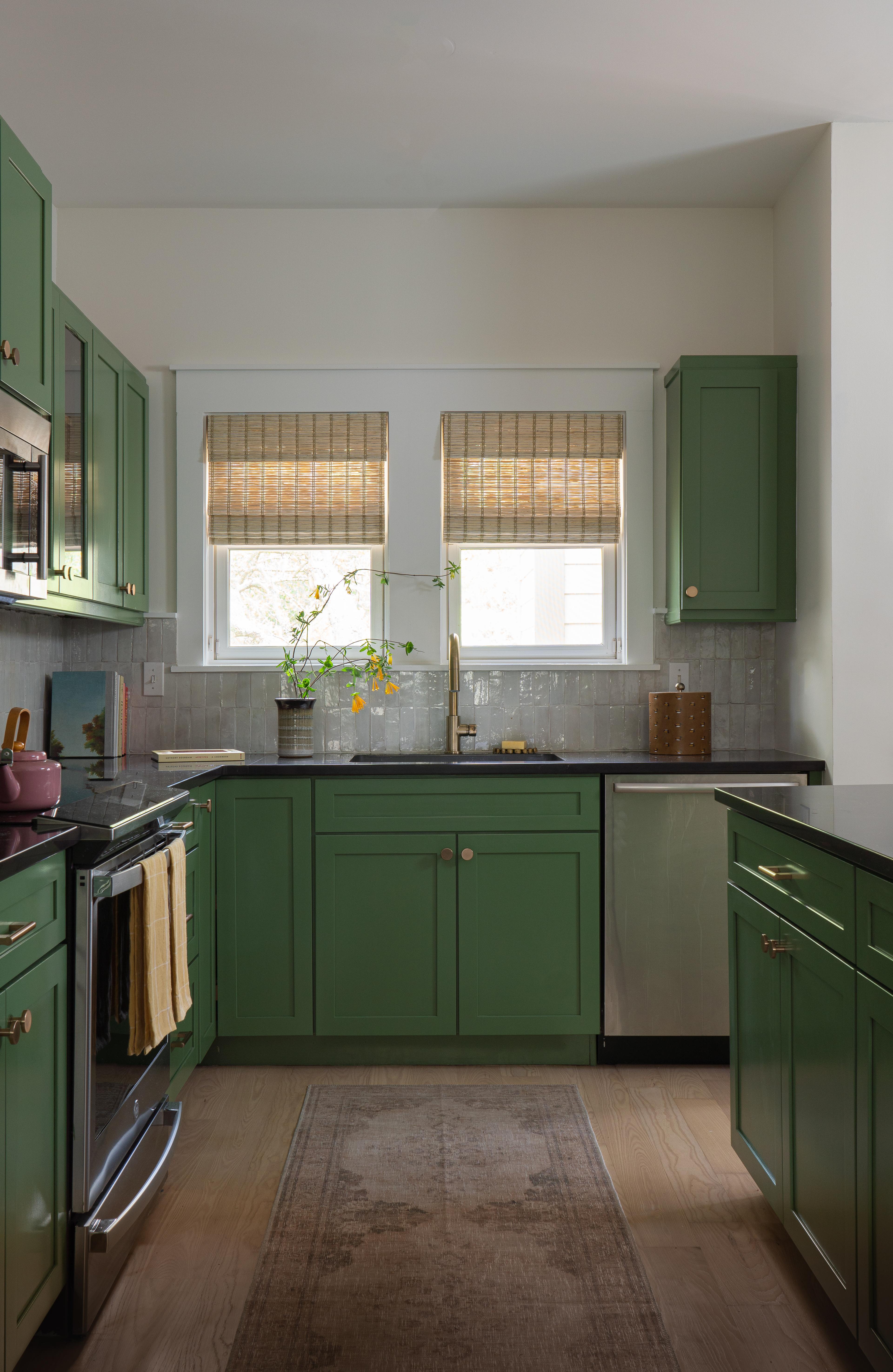 Cute green kitchen. 
