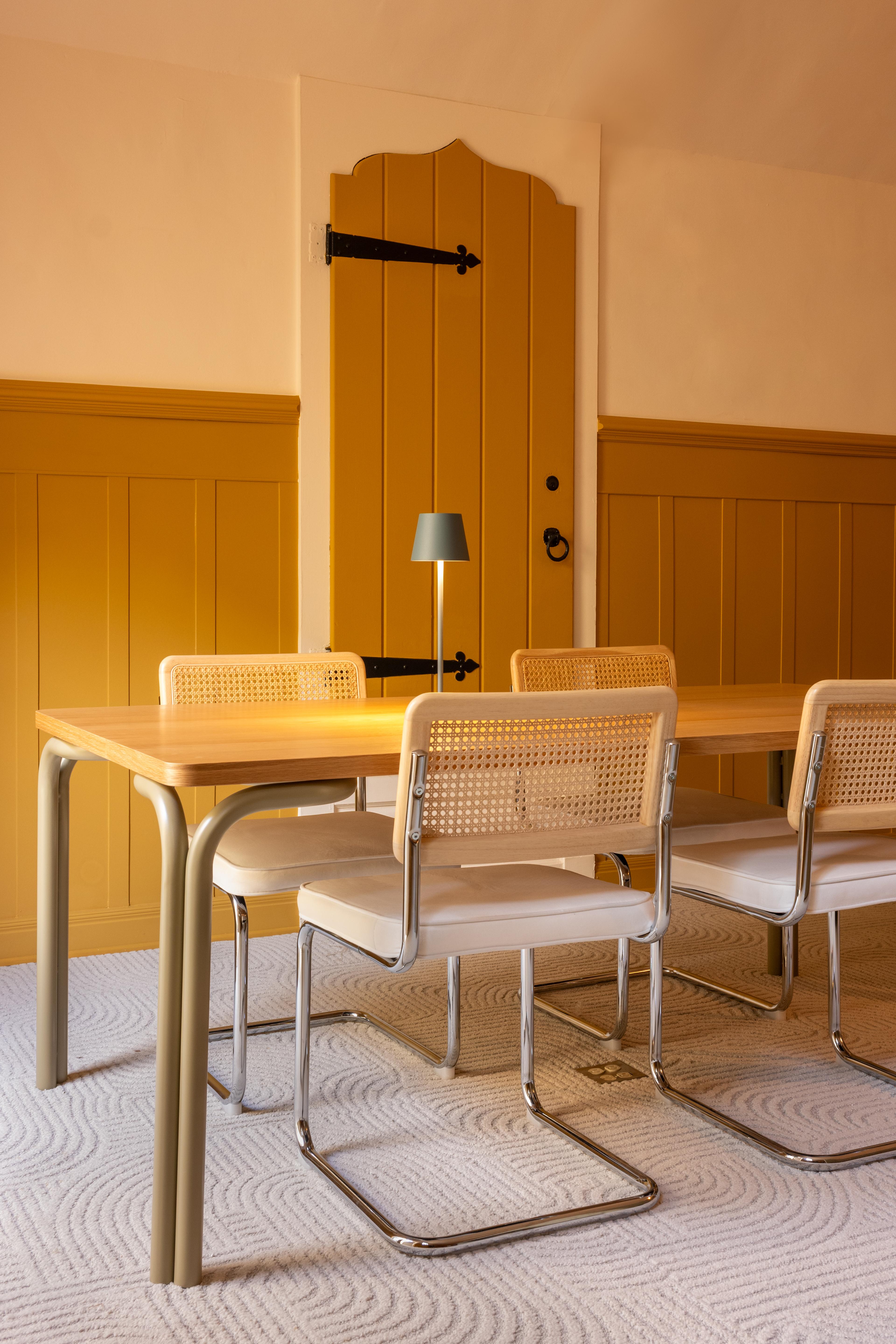 Mustard yellow dining space. 