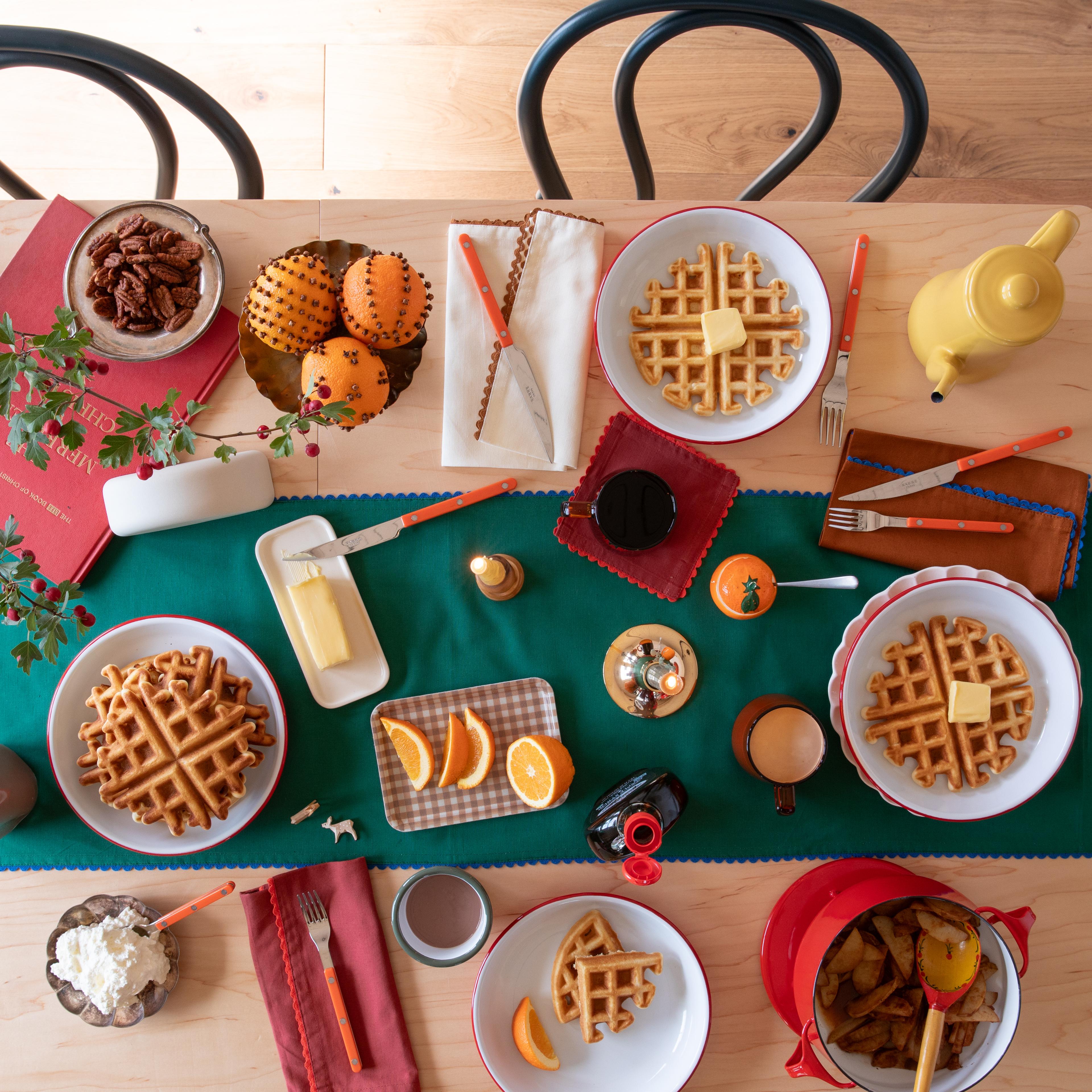 Dining table set for breakfast. 