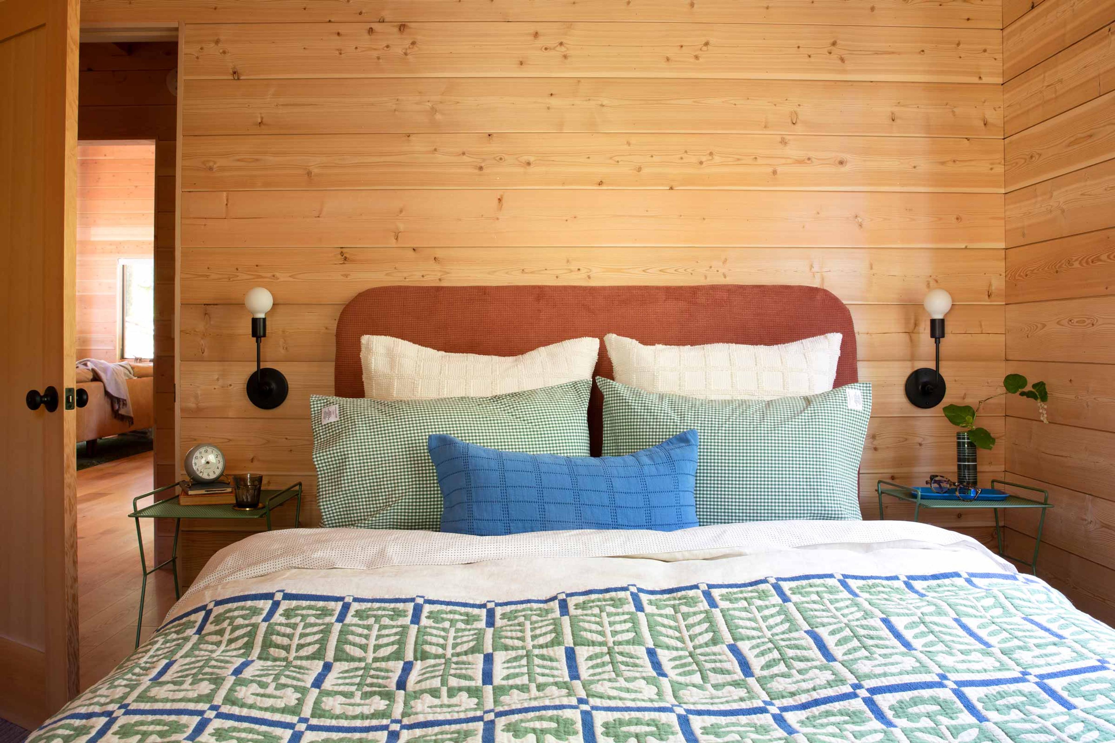 Cozy fall bed with a floral quilt.
