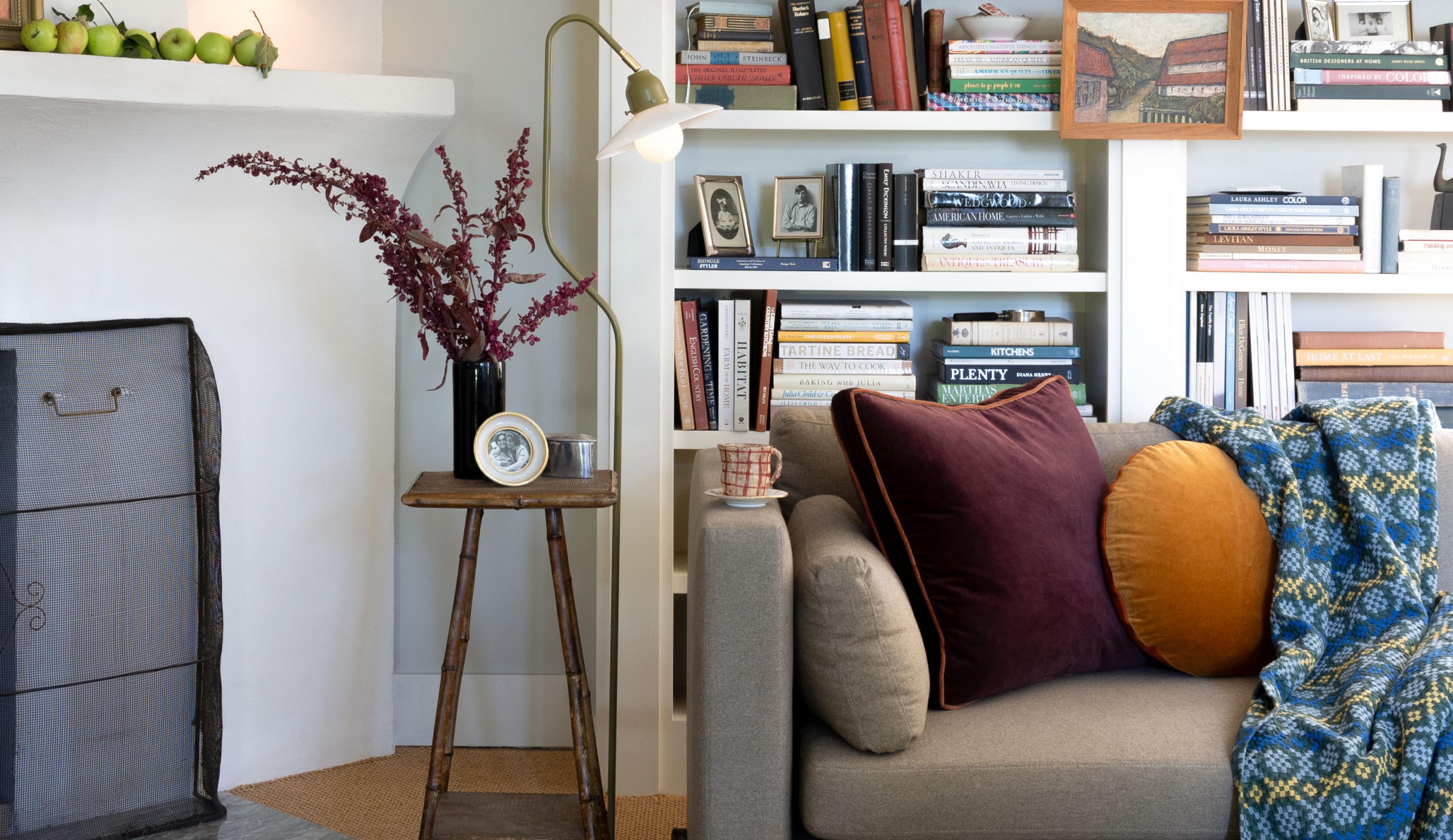 living room couch with colorful pillows  floor lamp 