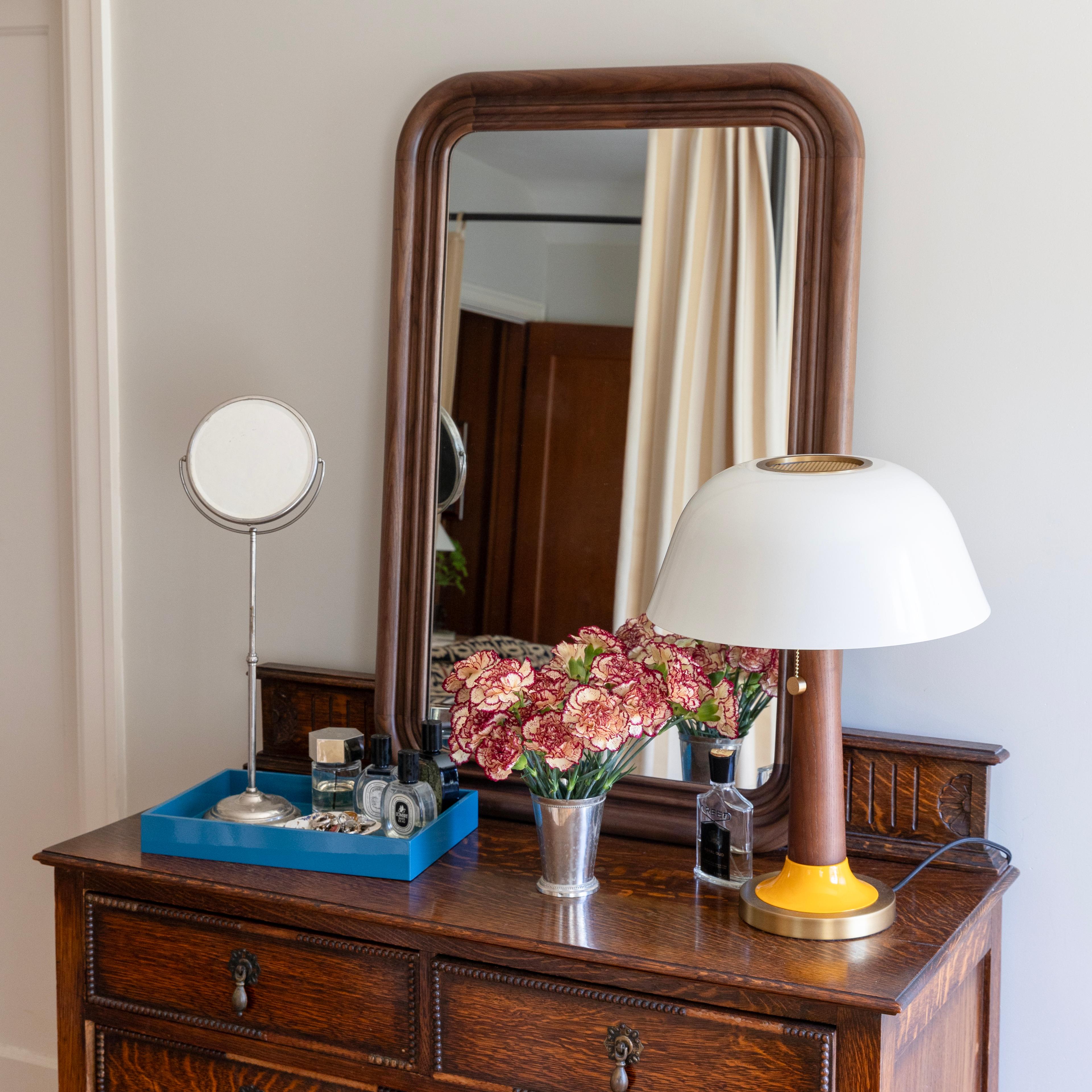 Mirror on dresser in bedroom. 