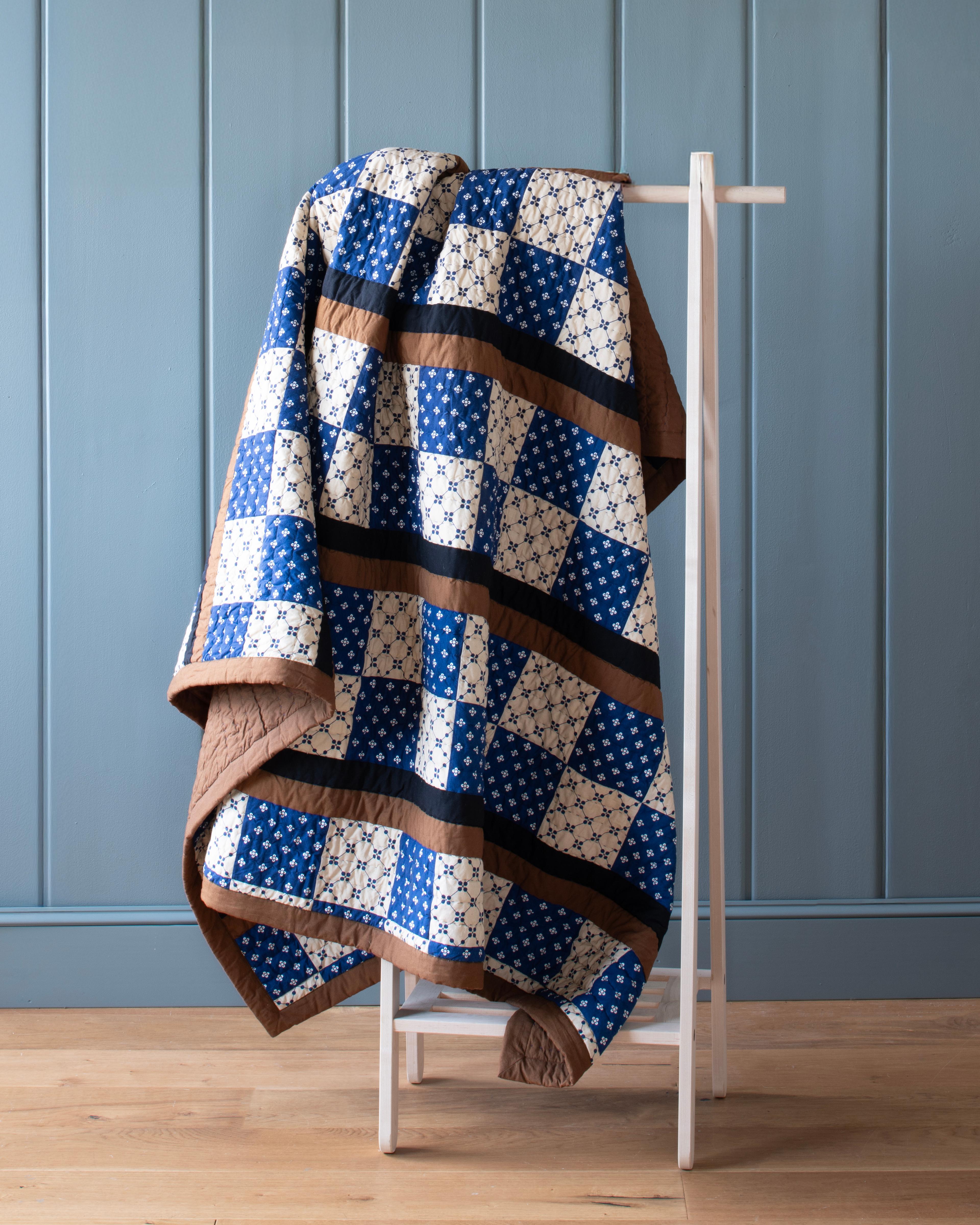 Quilt on a rack. 