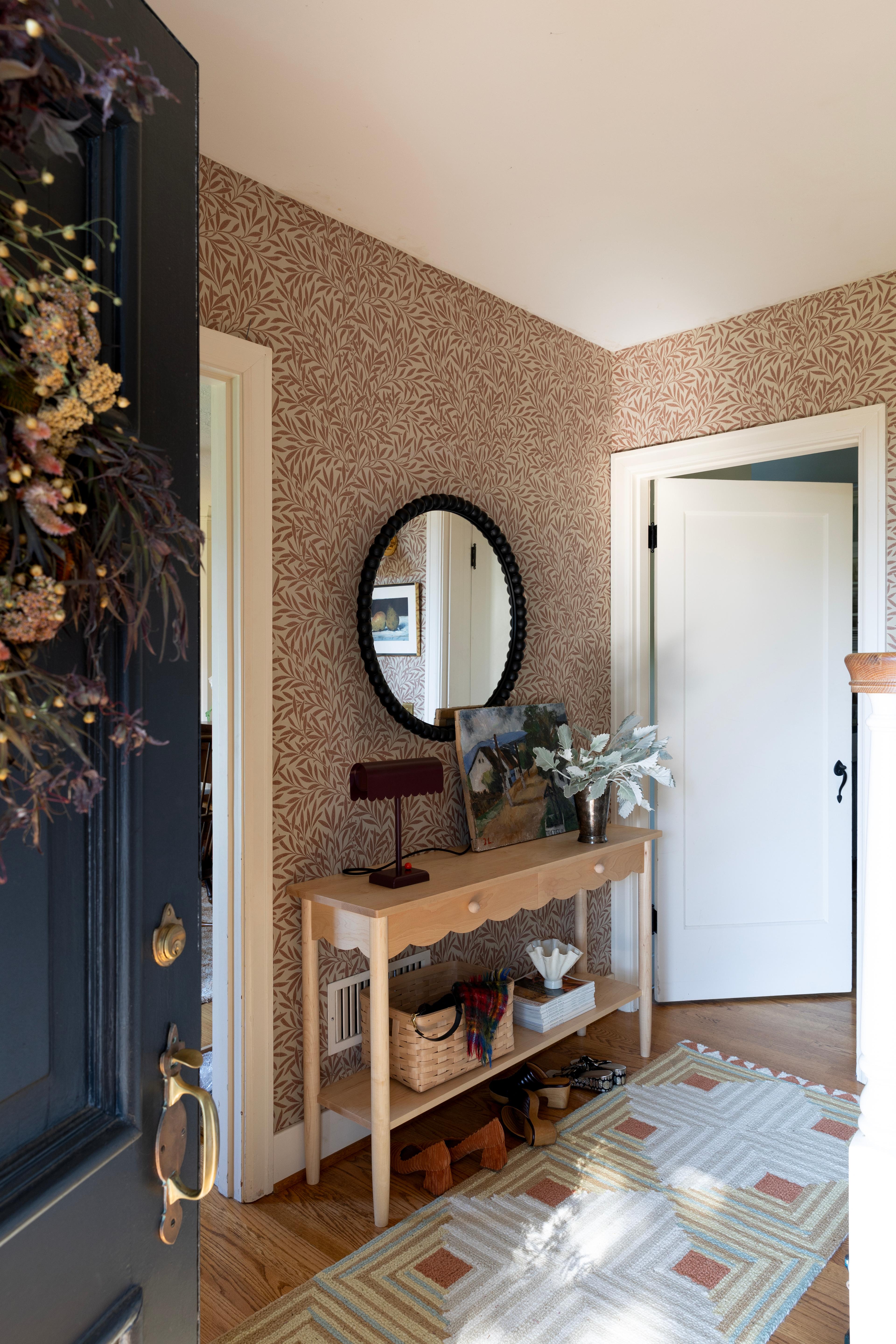 Wallpapered entryway. 