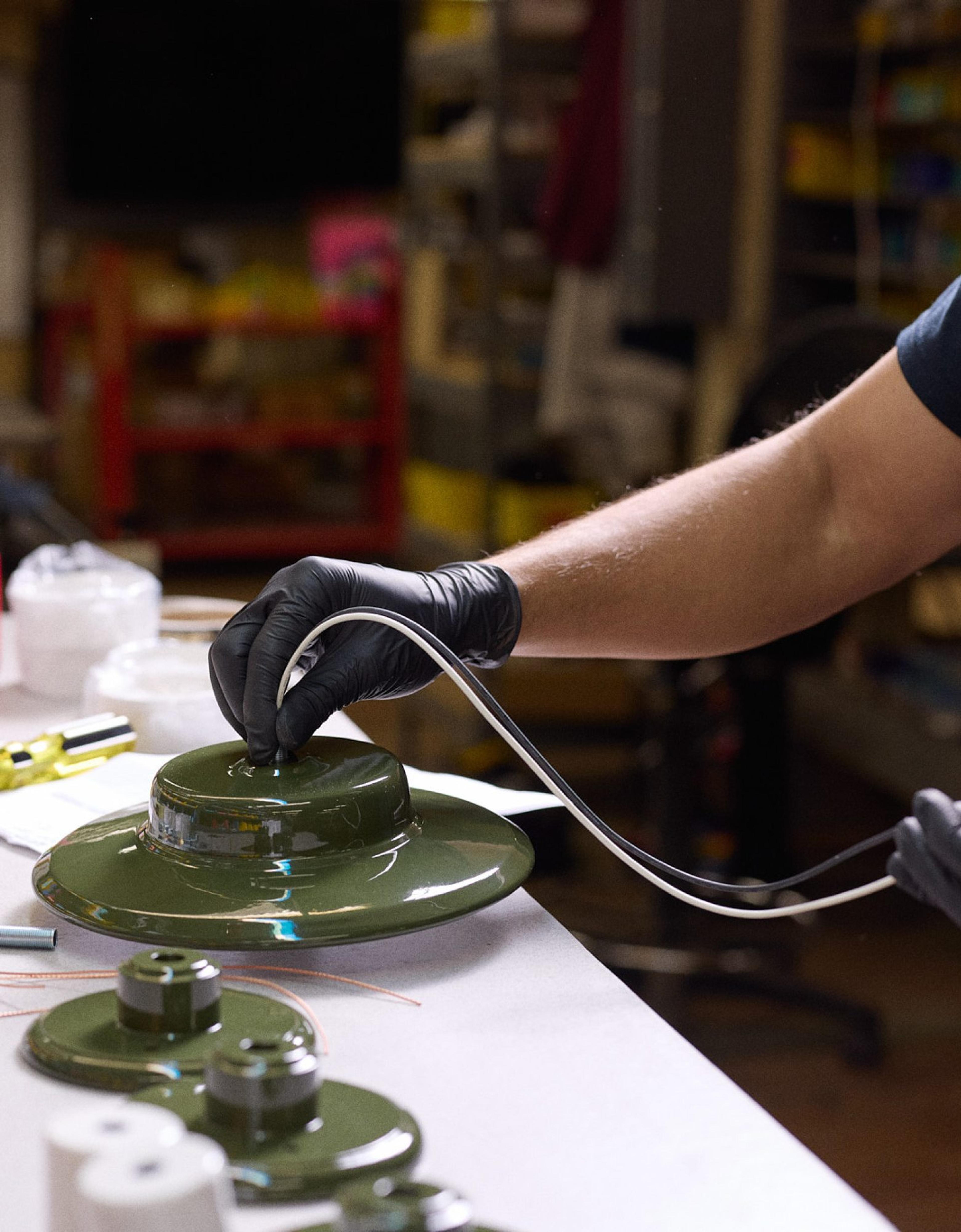 Buffing brass fixture in factory