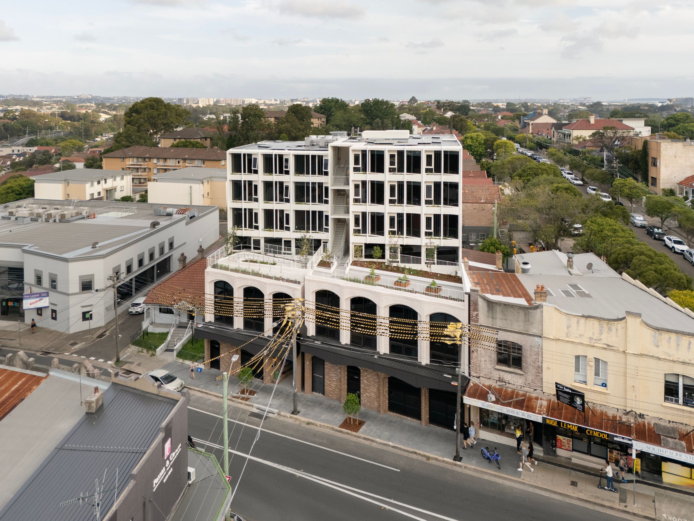 Semi-aerial view of Nightingale Marrickville situated amongst its eclectic context.