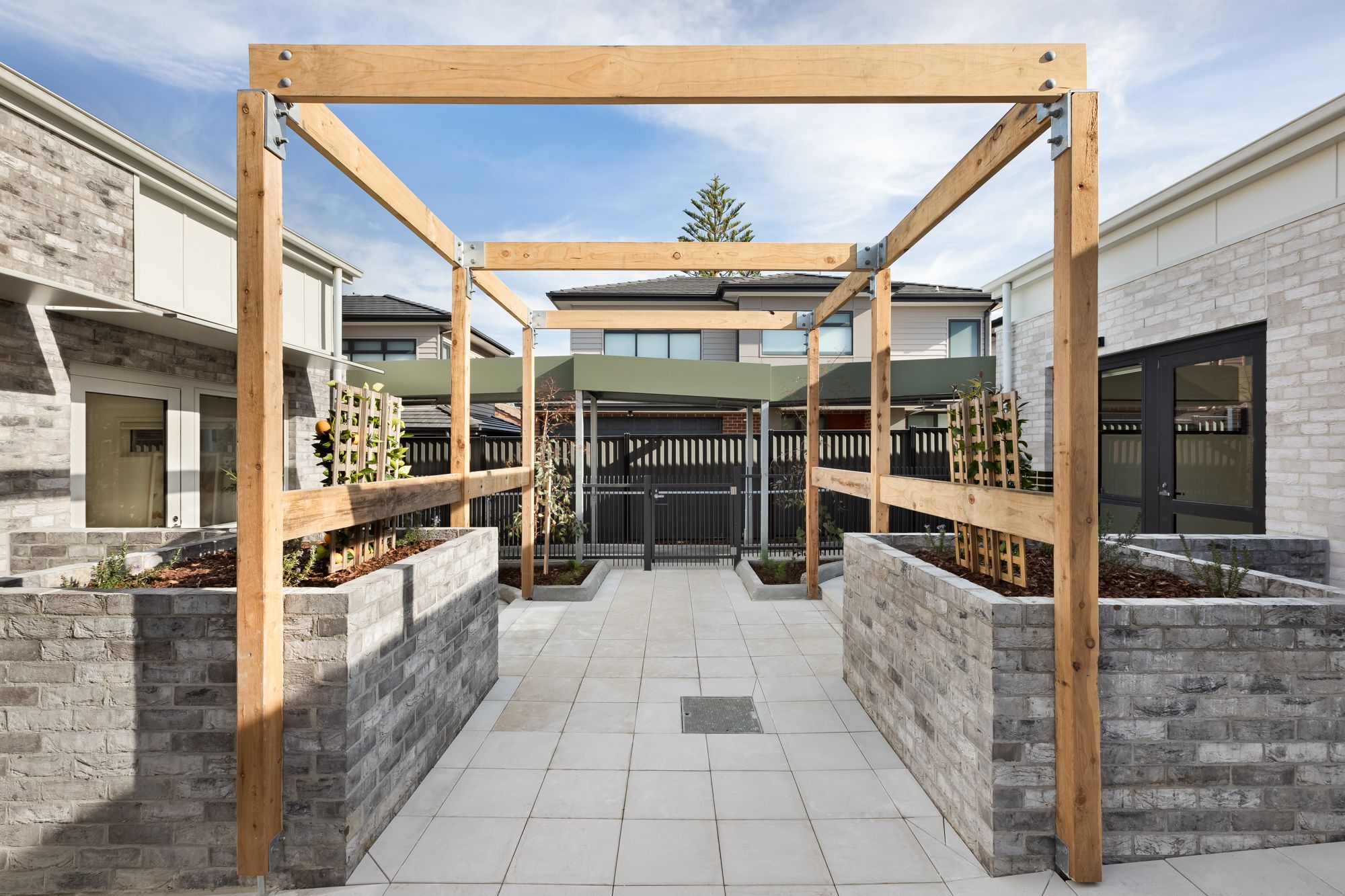 View of shared central courtyard and semi-private outdoor spaces.